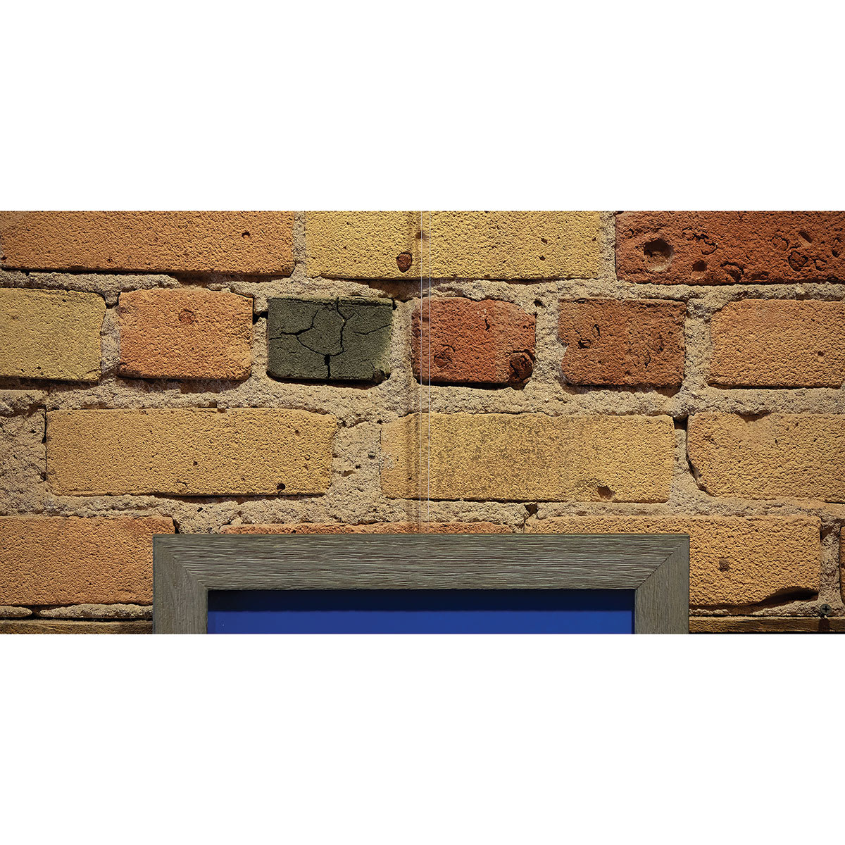 Walker System Plain Rod - Clear Acrylic, 72" - in use to hold up art on brick wall