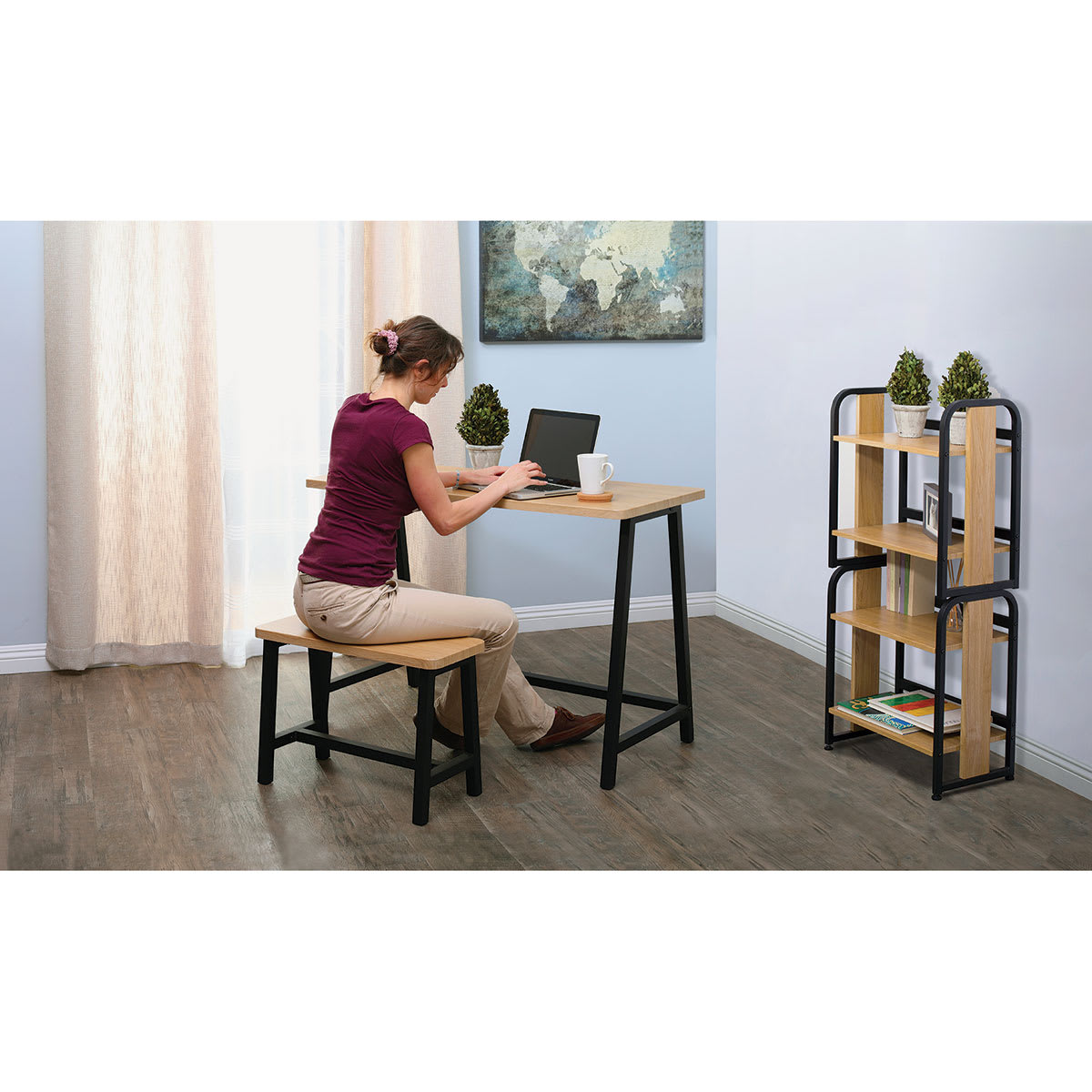 Studio Designs Ashwood Homeroom Desk and Bench - Woman seated at desk working on computer Studio Designs Ashwood Homeroom Desk and Bench - Woman seated at desk working on computer