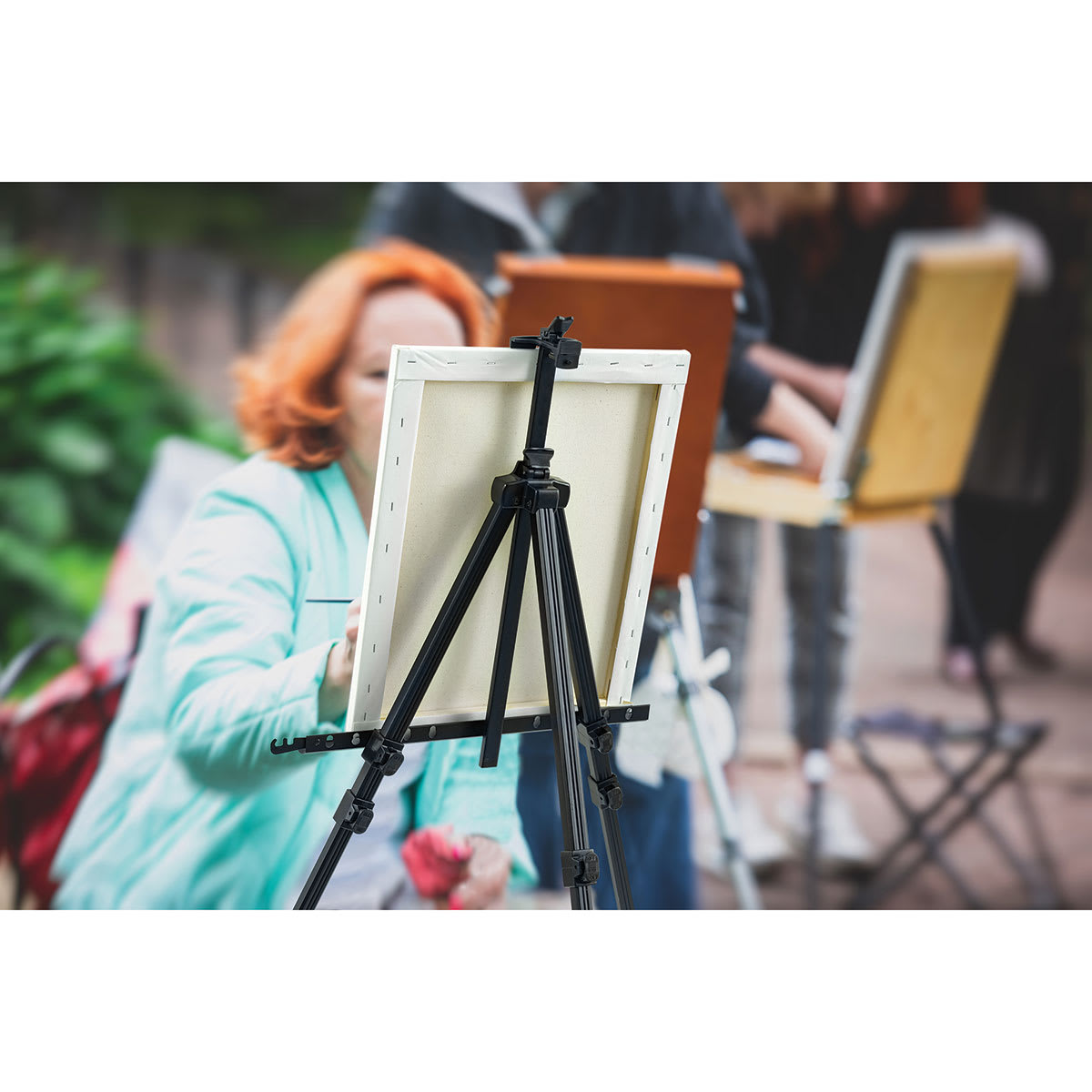 Blick Studio Aluminum Tripod Travel Easel holds canvas securely for plein air painting.