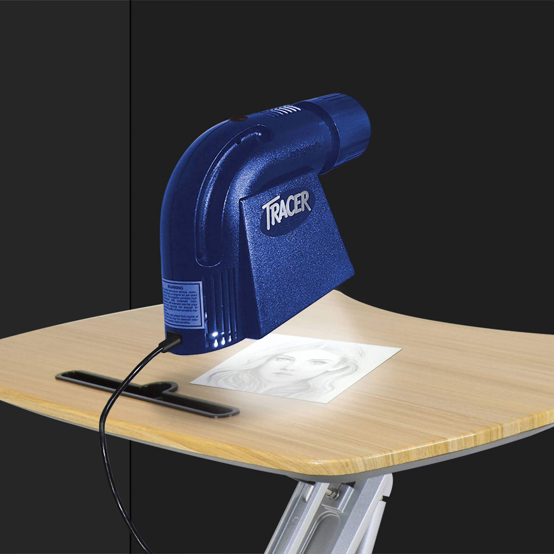Artograph LED Tracer Projector, being placed on top of the artwork