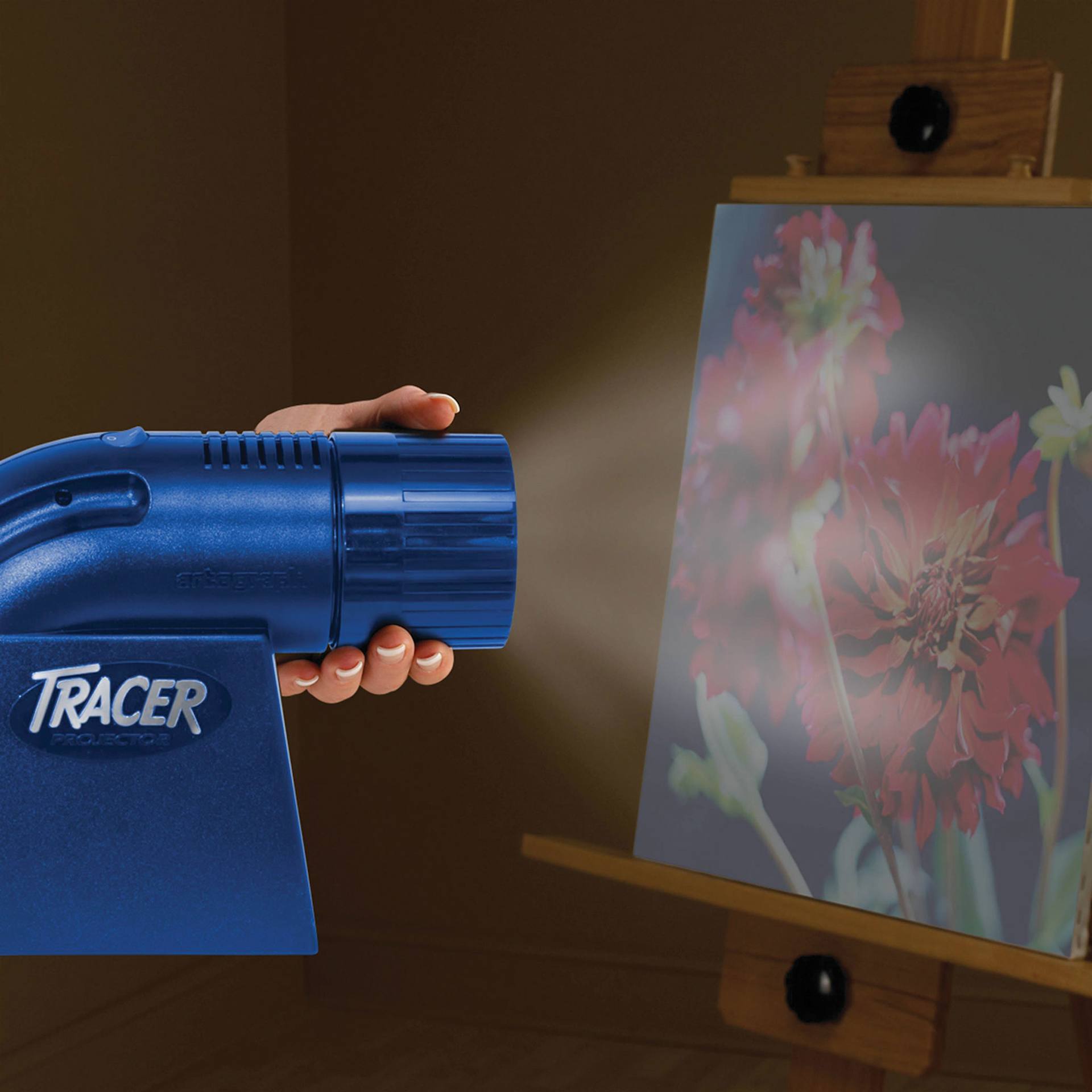 Artograph LED Tracer Projector, in hand adjusting zoom