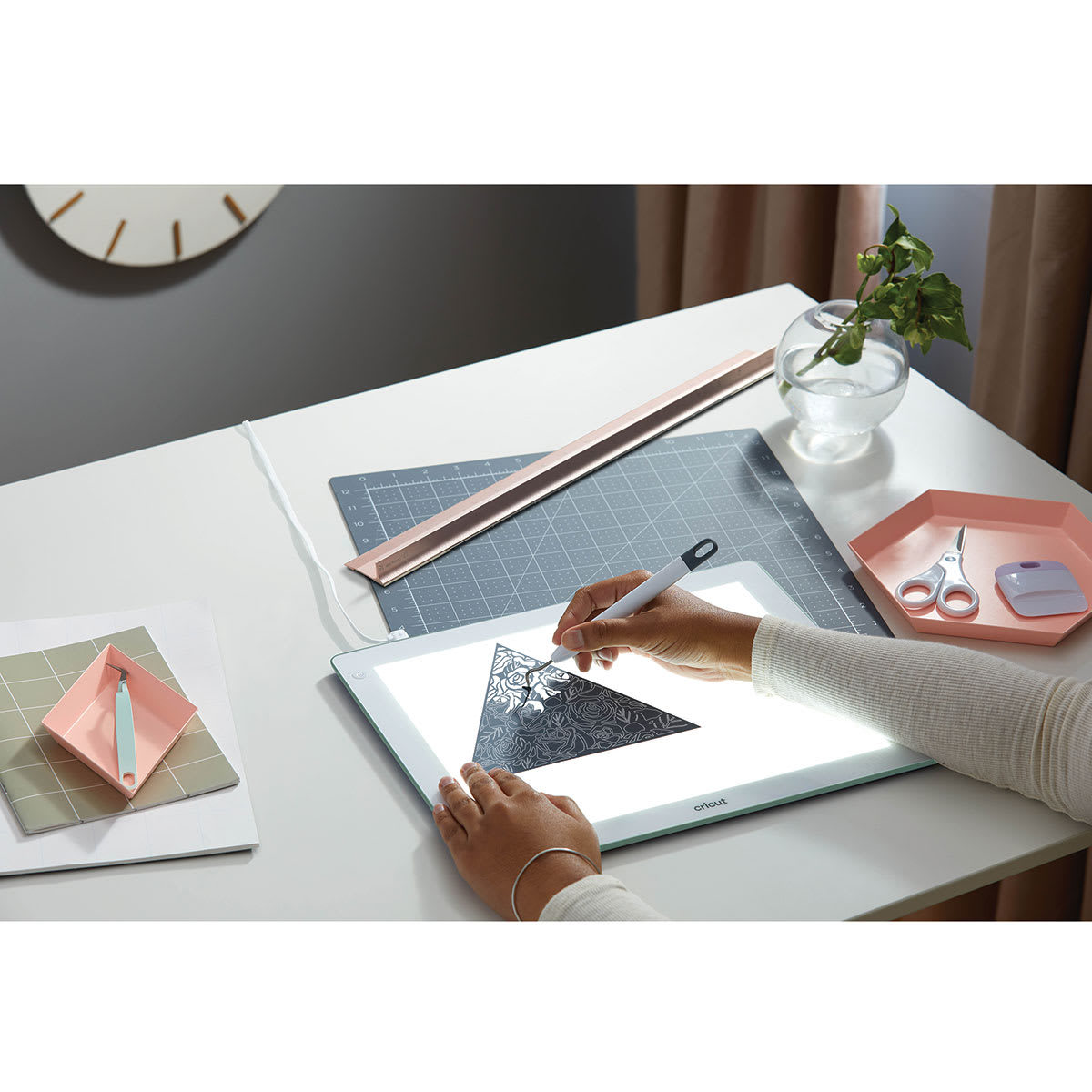 Cricut BrightPad - Mint, 13-1/2" x 11" (Person weeding vinyl on BrightPad)