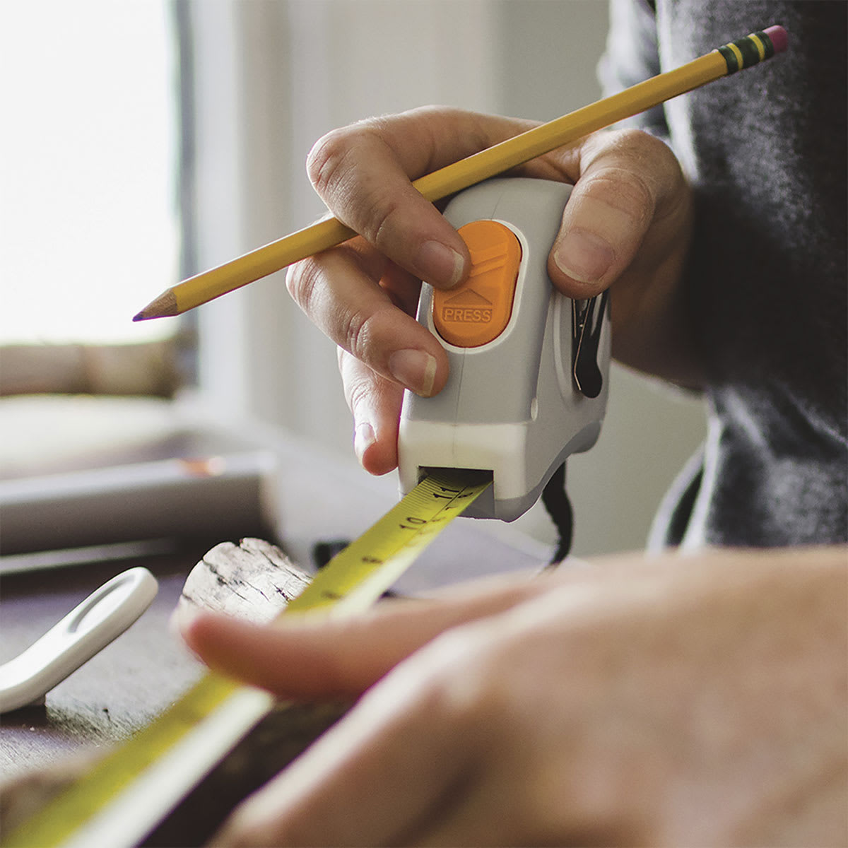 Fiskars DIY Tape Measure - Closeup photo of person using Tape Measure
