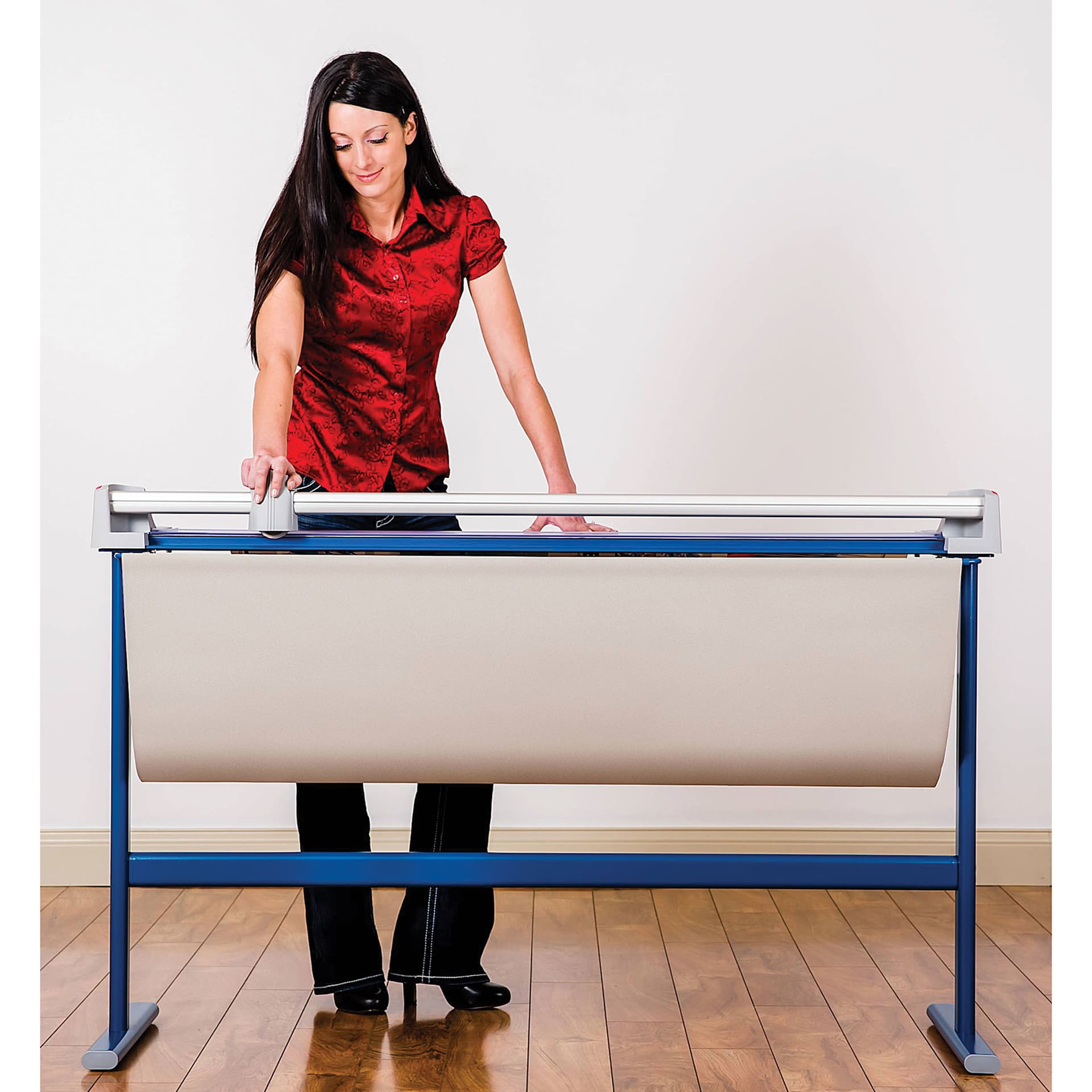 Dahle Large Format Premium Rotary Trimmer - 51" Cutting Length, adult in front of the trimmer