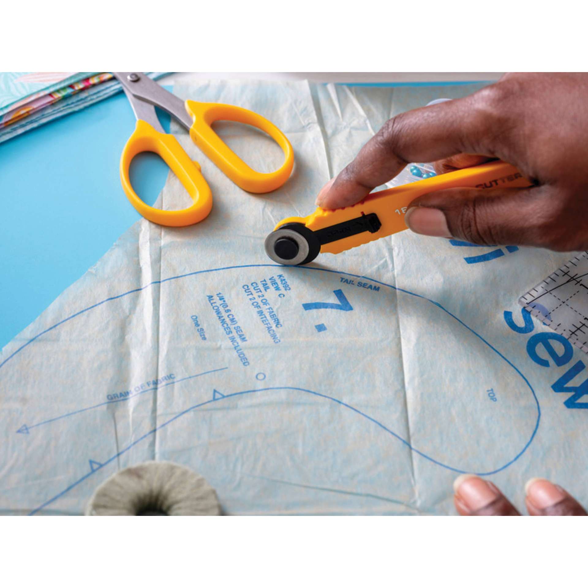 Olfa Quick-Change Rotary Cutter, in hand cutting template