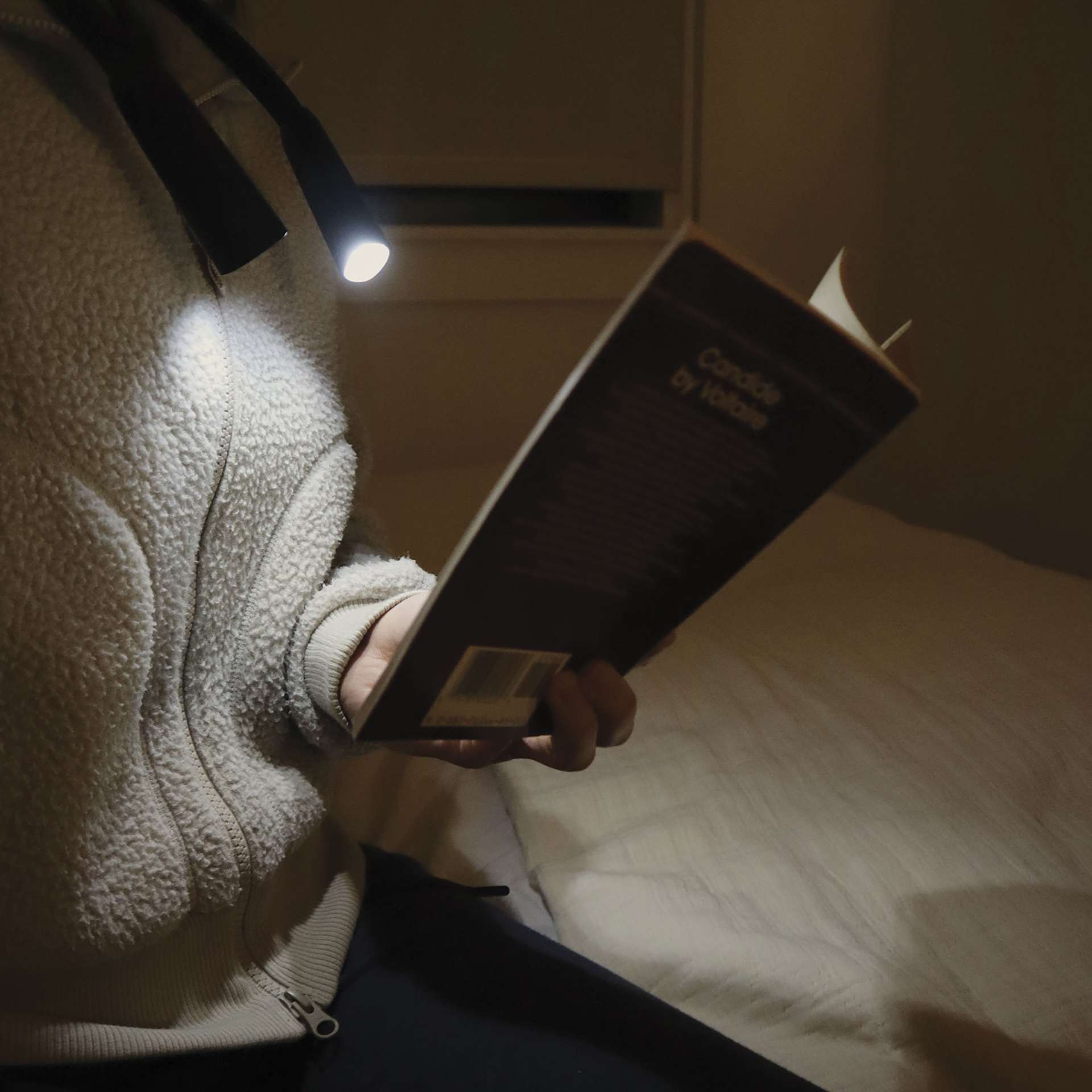 Kikkerland Hands-Free Book Light, book being read with white light