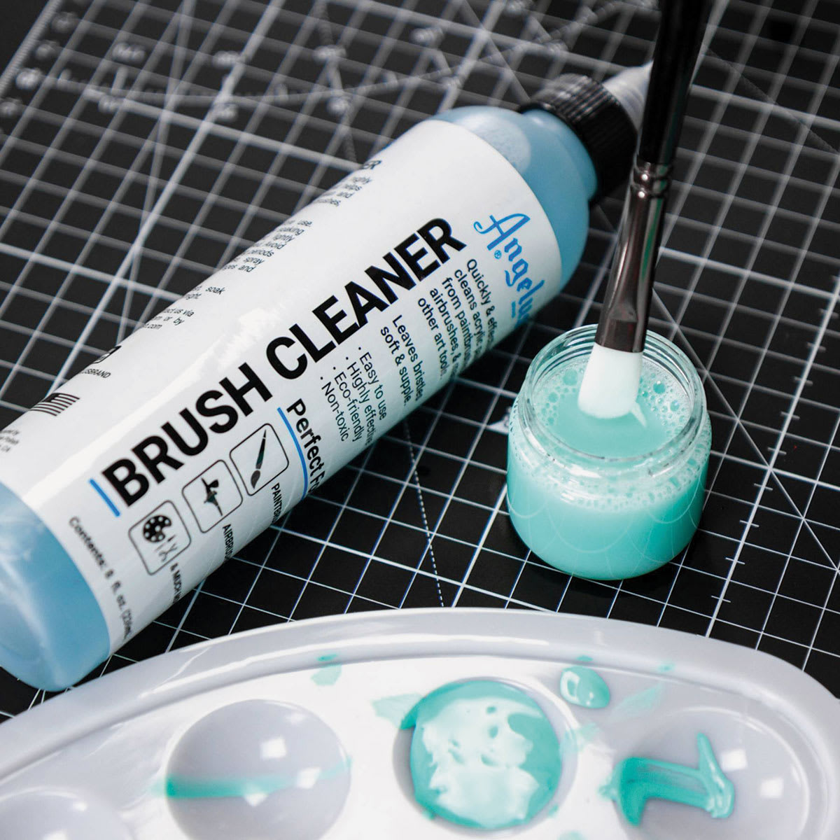 Angelus Brush Cleaner - 8 oz, Bottle (Brush being cleaned with brush cleaner) Angelus Brush Cleaner - 8 oz, Bottle (Brush being cleaned with brush cleaner)