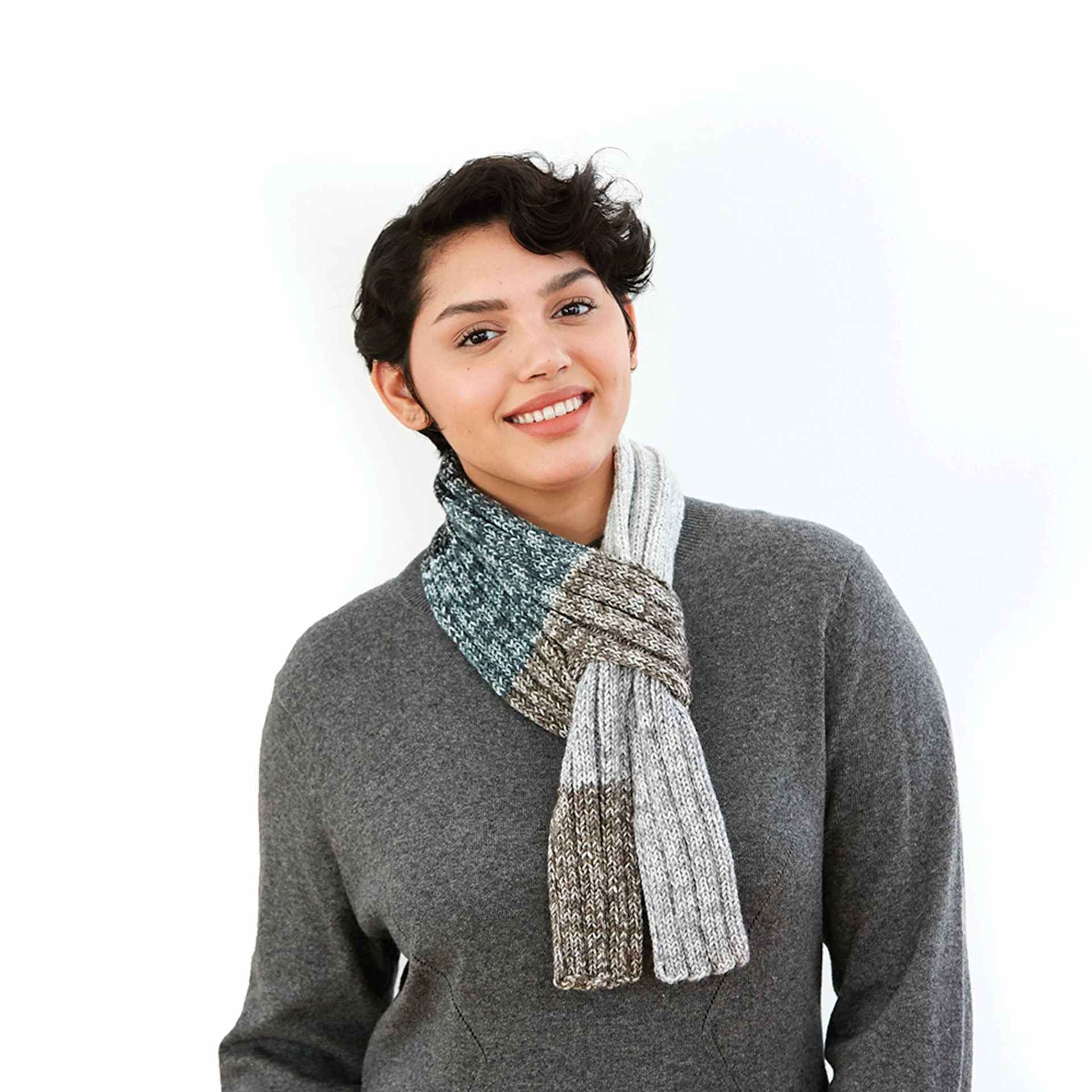Lion Brand Mandala Ombre Yarn, person wearing a scarf made out of yarn