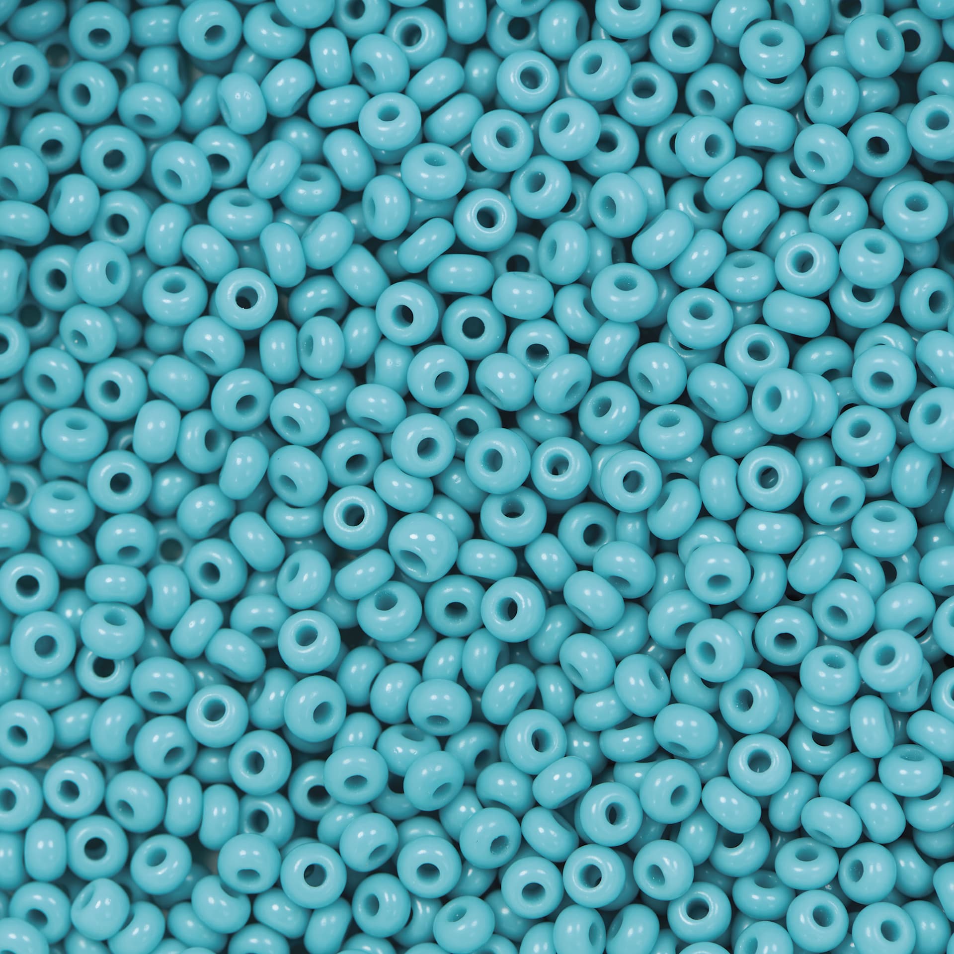 John Bead Czech Glass Seed Beads - Turquoise Blue, Opaque, 10/0, 22 g Vial close up