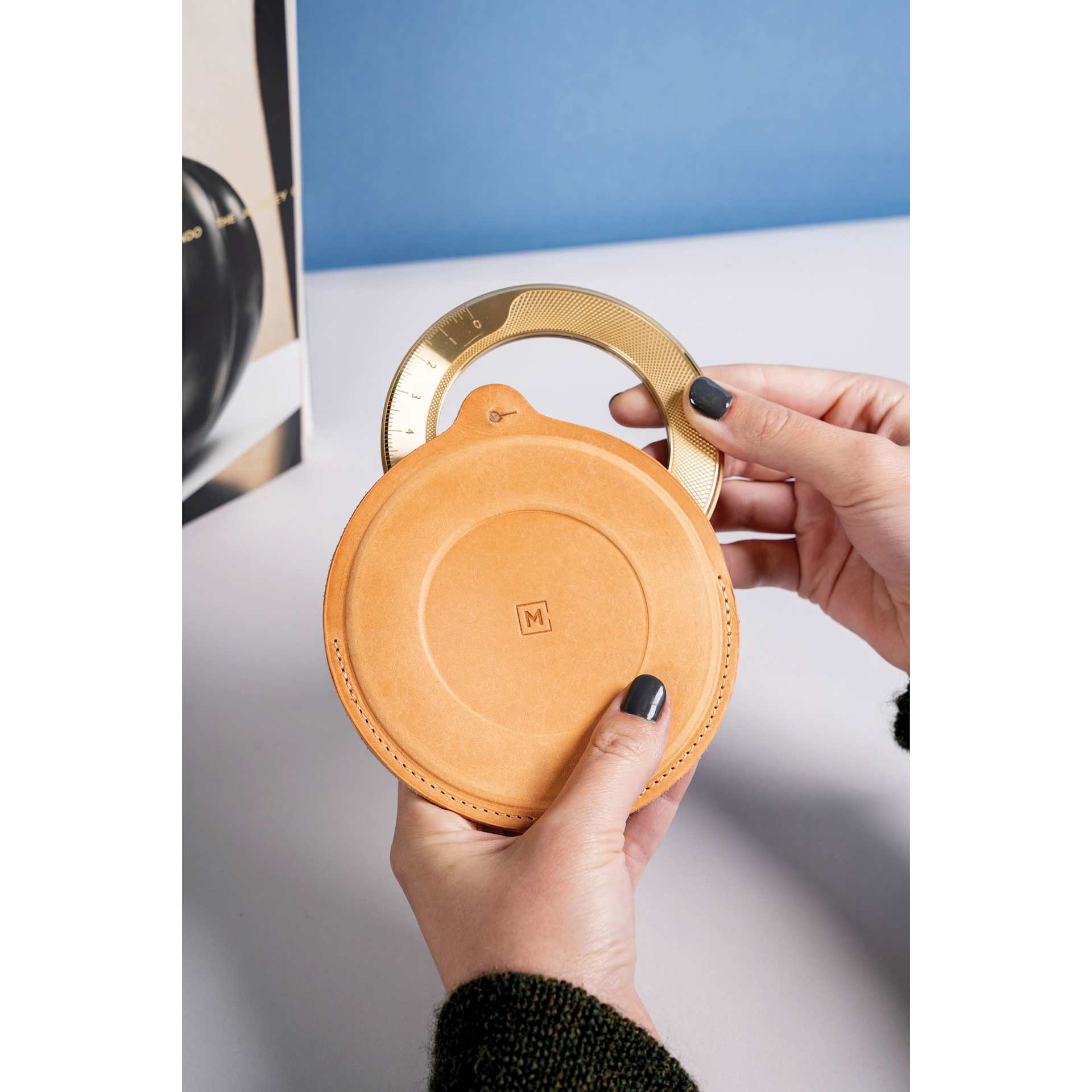 Makers Cabinet Leather Iris Sheath - 5" Diameter, held in hands (iris not included)