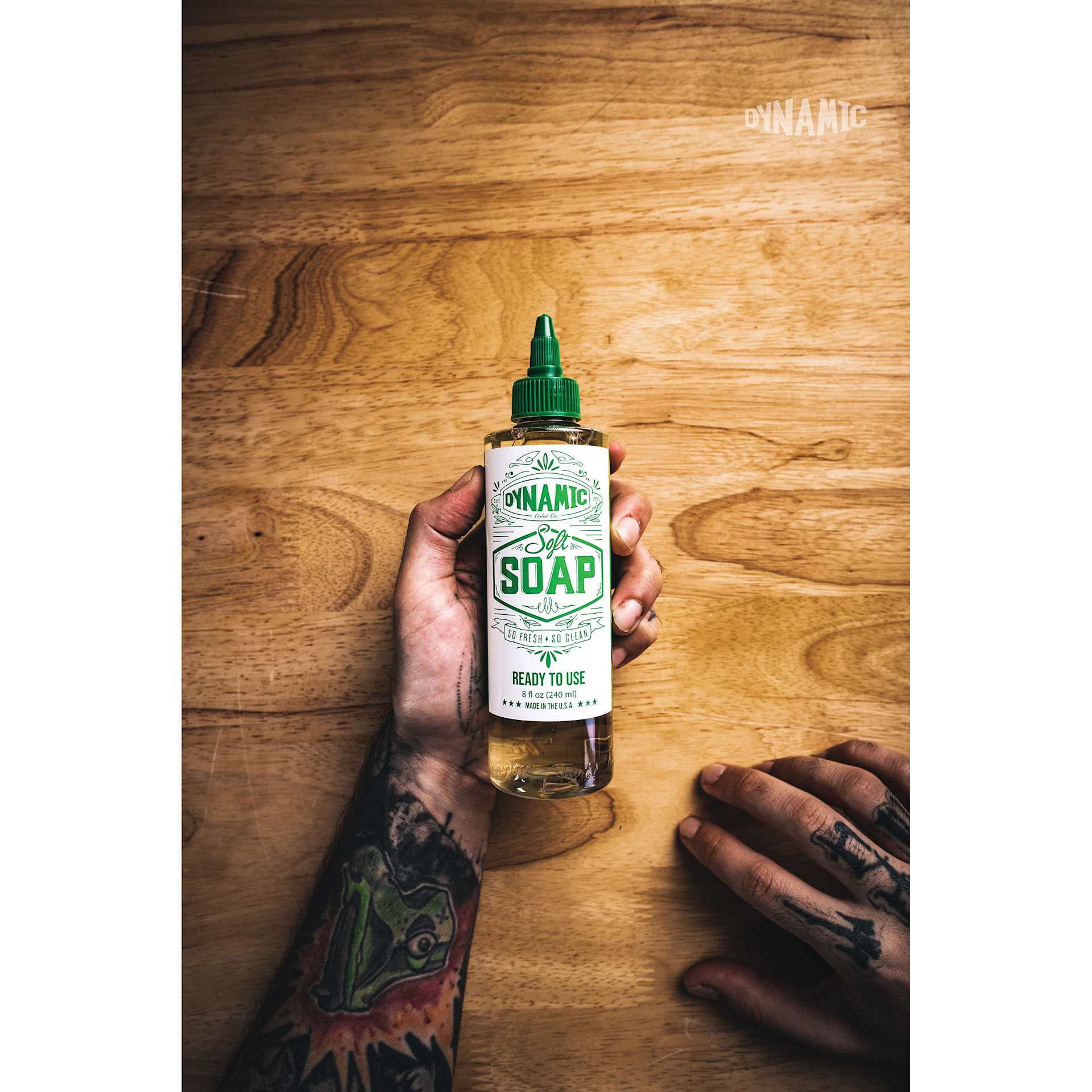 Dynamic Color Soft Green Soap - 8 oz, in-hand on desk