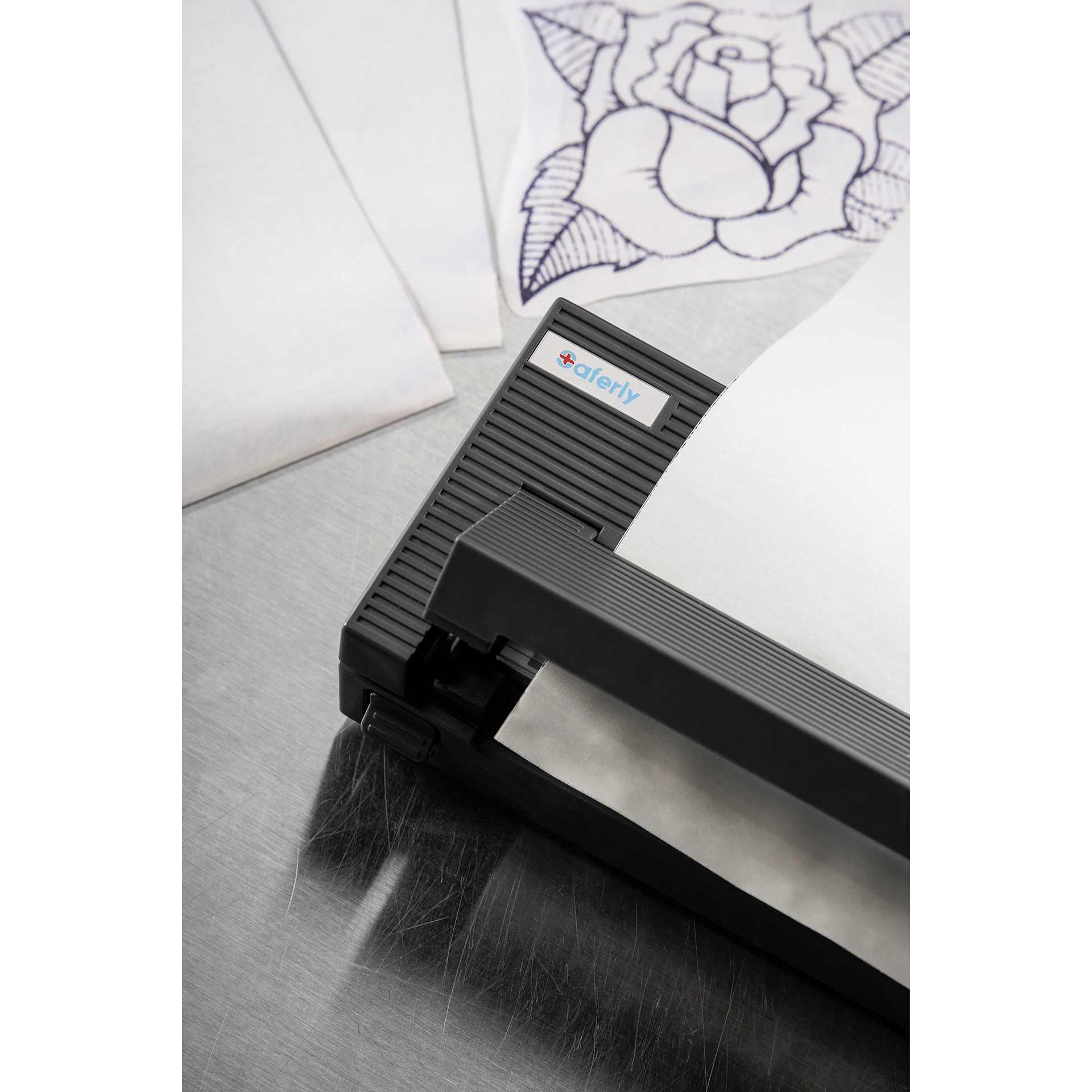 Saferly Bluetooth Stencil Printer, printed stencil on desk with printer