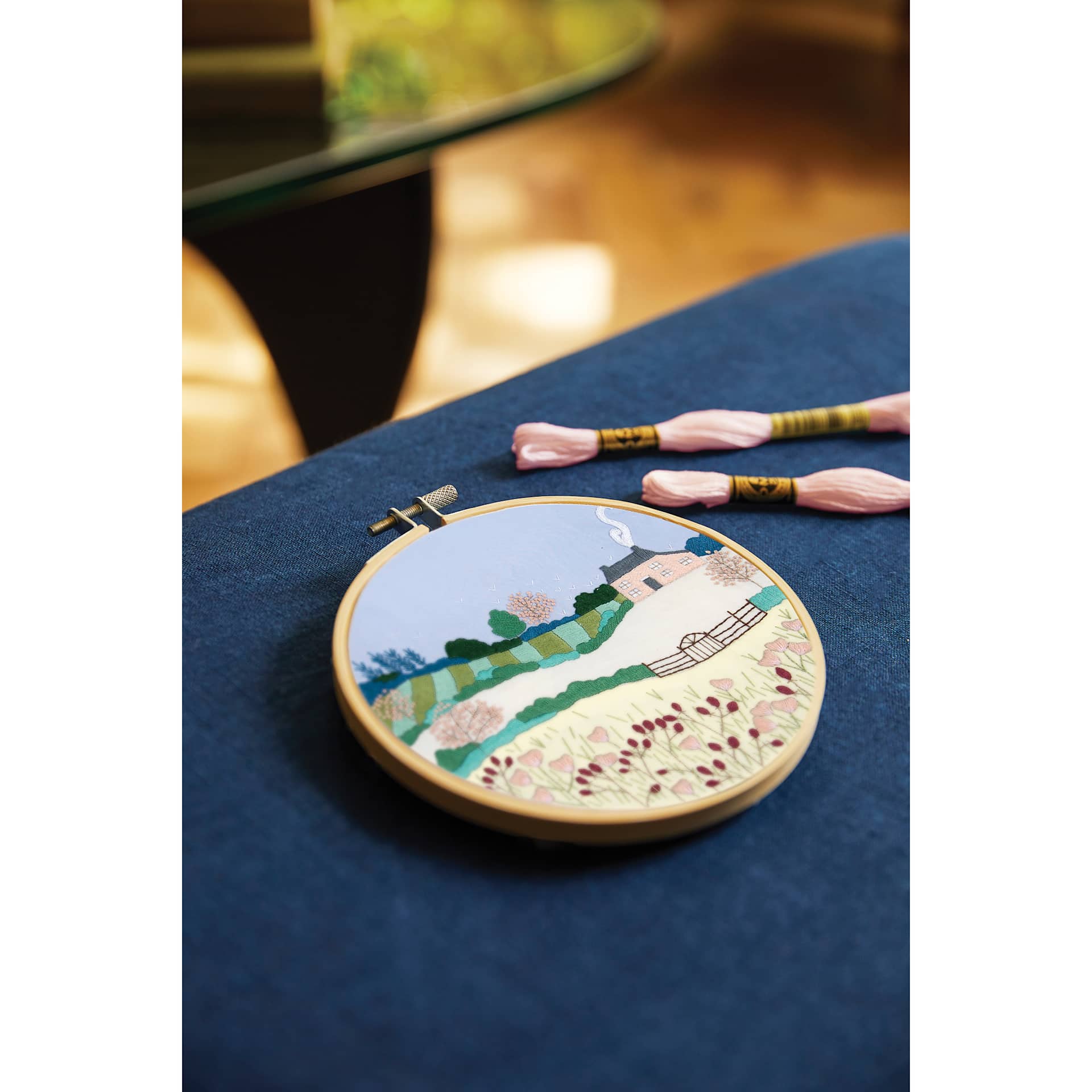 DMC The Designer Collection Embroidery Kits - “Spring Landscape” by Georgie K Emery, Advanced finished piece on table