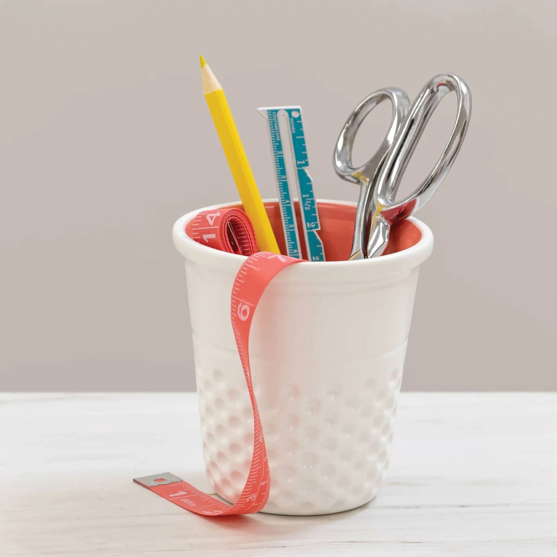 Dritz Ceramic Thimble Container - Coral - on desk (items not included)