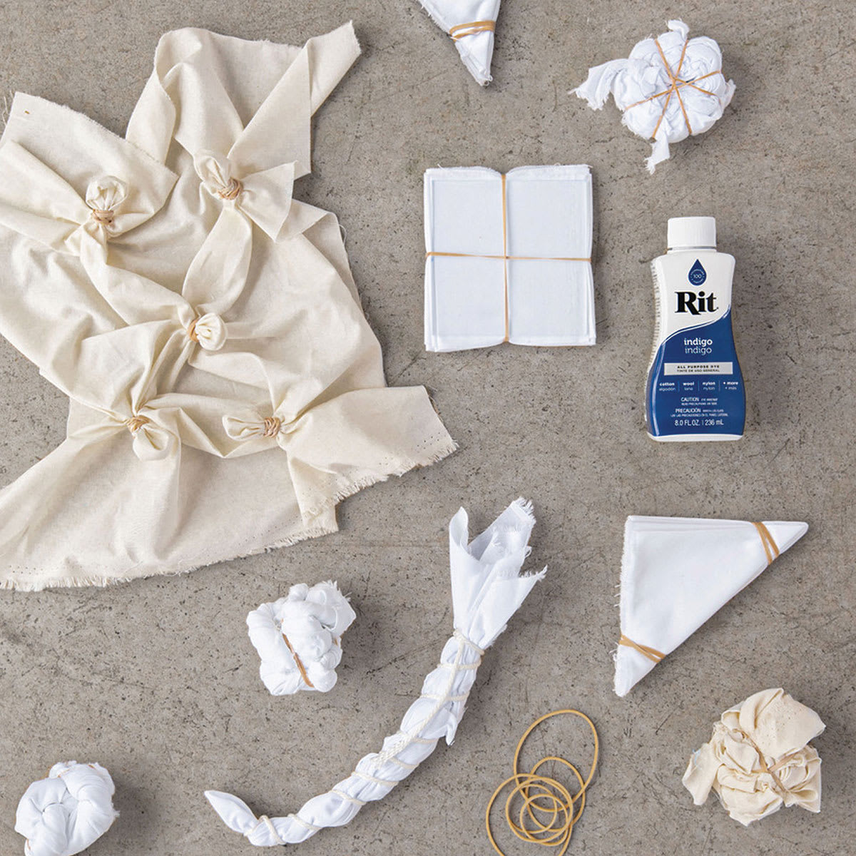 Rit Indigo Shibori Tie Dye Kit - Various materials shown with 1 Rit bottle ready for dyeing 