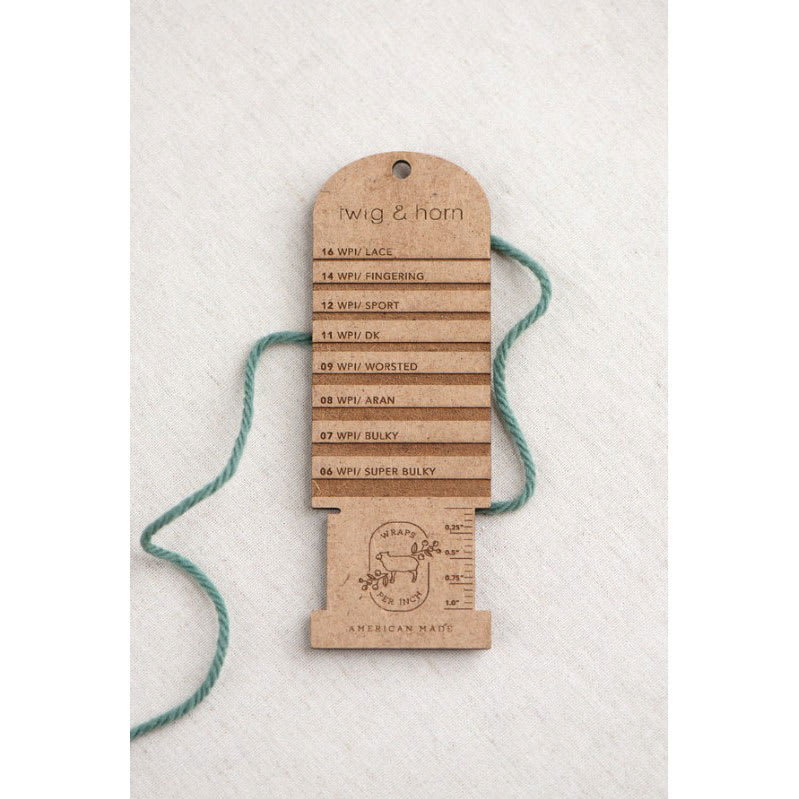 Twig & Horn Wraps Per Inch Tool with yarn thread