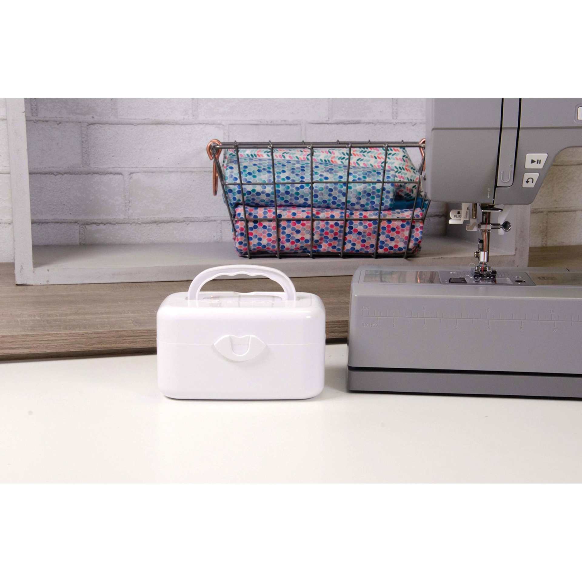 Singer Portable Bobbin Winder, next to a full size sewing machine