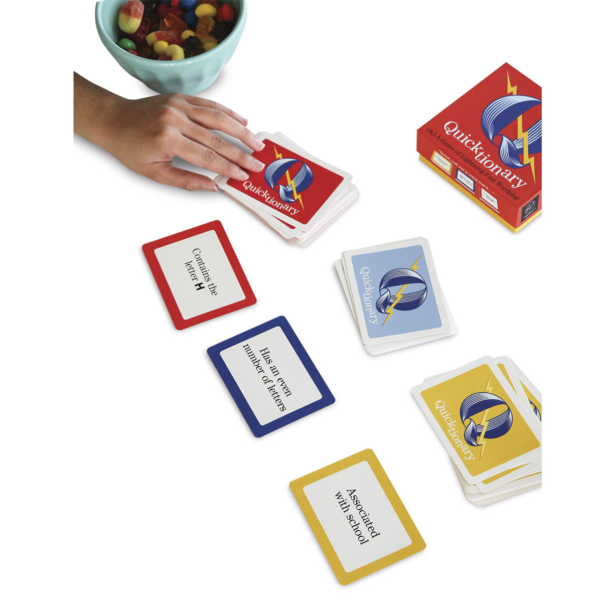 Quicktionary - Hand reaching for red card during play