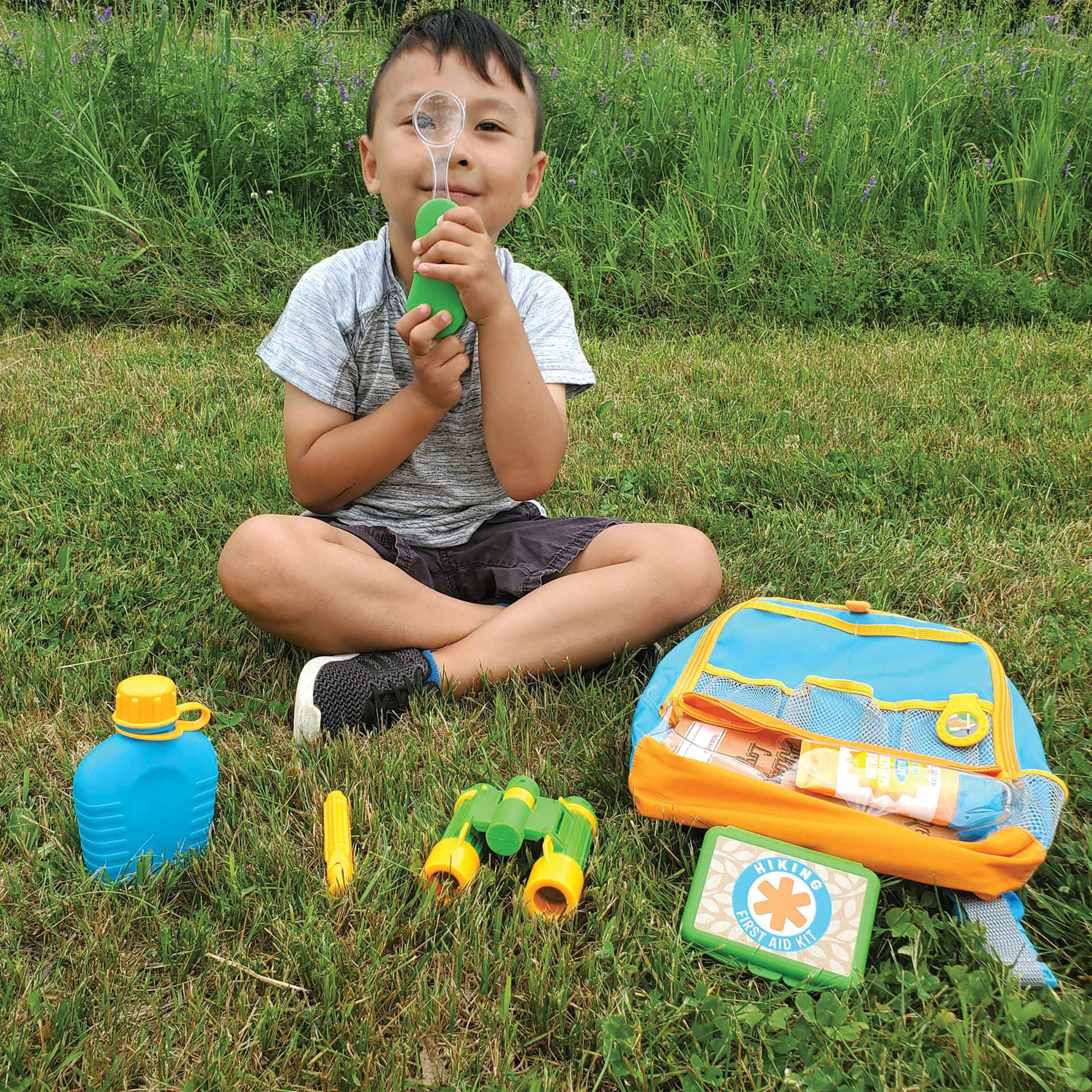 Melissa & Doug Let's Explore Hiking Play Set (Child in grass with backpack)