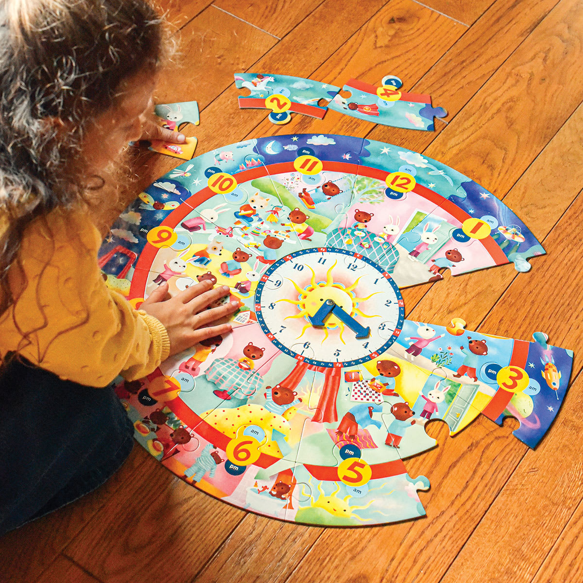 Eeboo Around the Clock 25 Piece Puzzle, child completing puzzle
