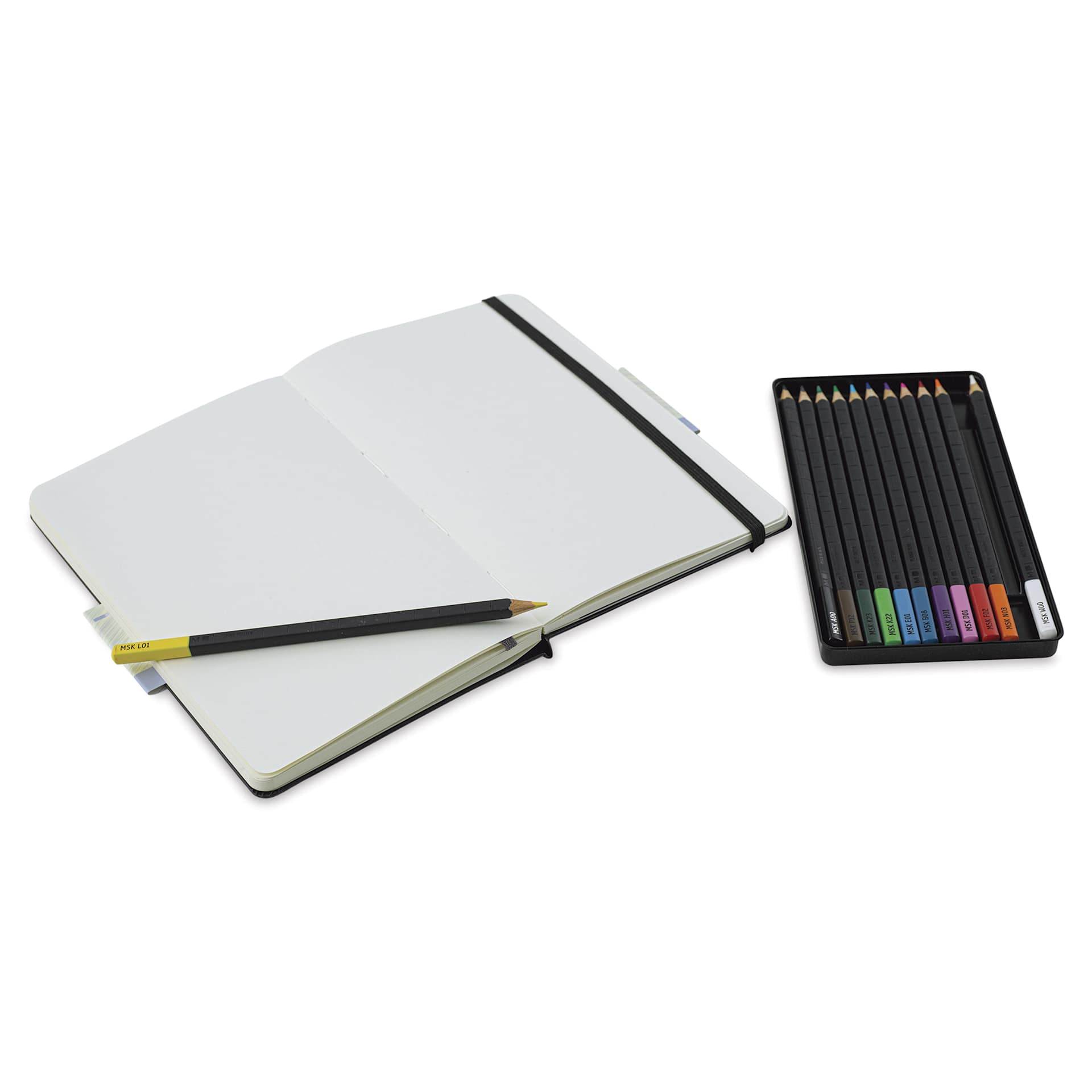 Moleskine Art Sketching Kit, sketchbook open next to pencils
