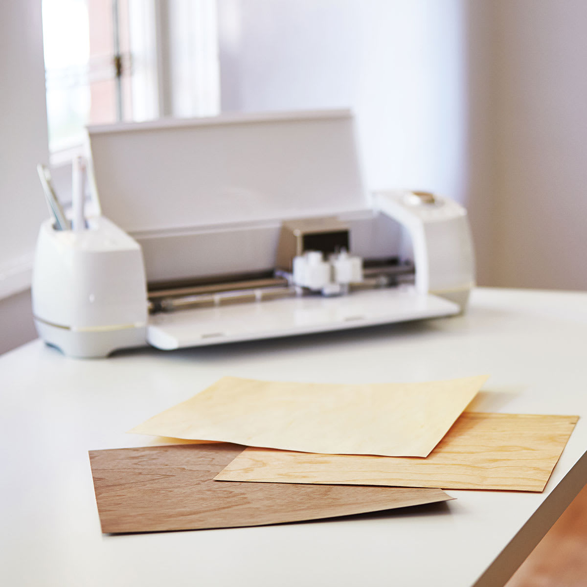 Cricut Wood Veneer - Cutting Machine shown with Veneer sheets