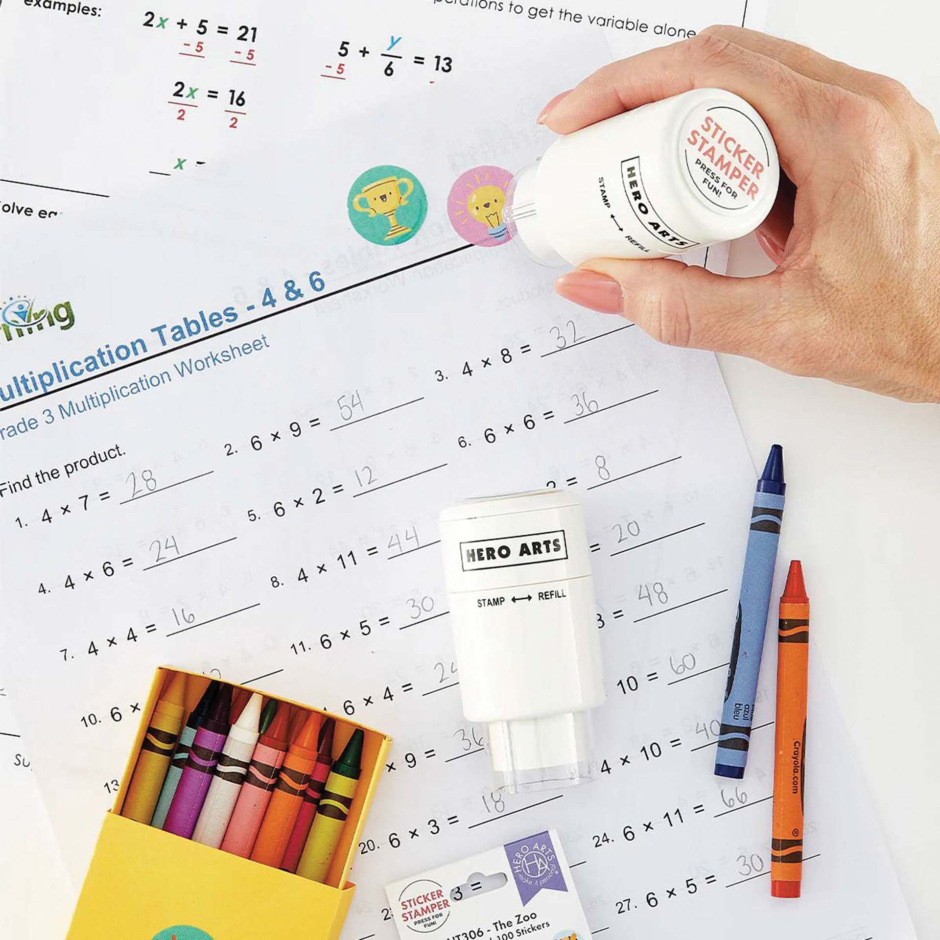 Hero Arts Sticker Stamper Refill Pack - Pkg of 100, 7/8", Bookworm stickers being applied to worksheet