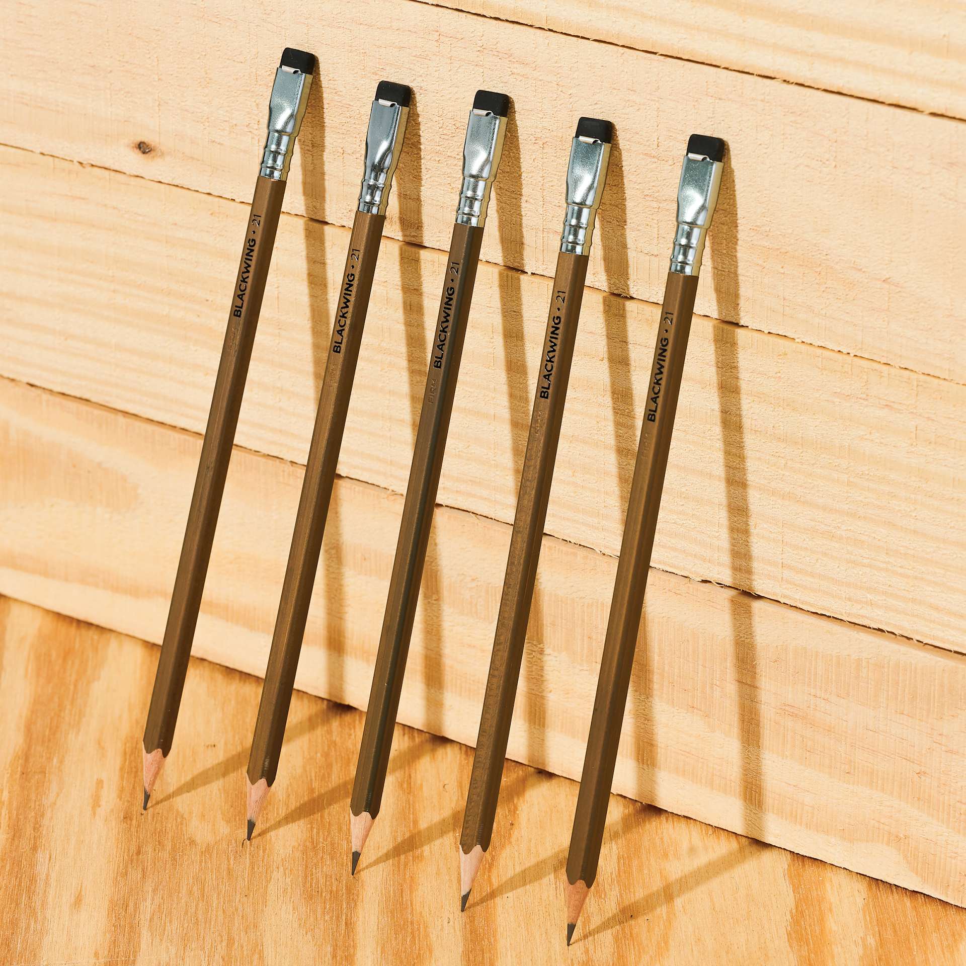 Blackwing Volume 21 Pencils - Set of 12, five pencils propped up against wooden boards