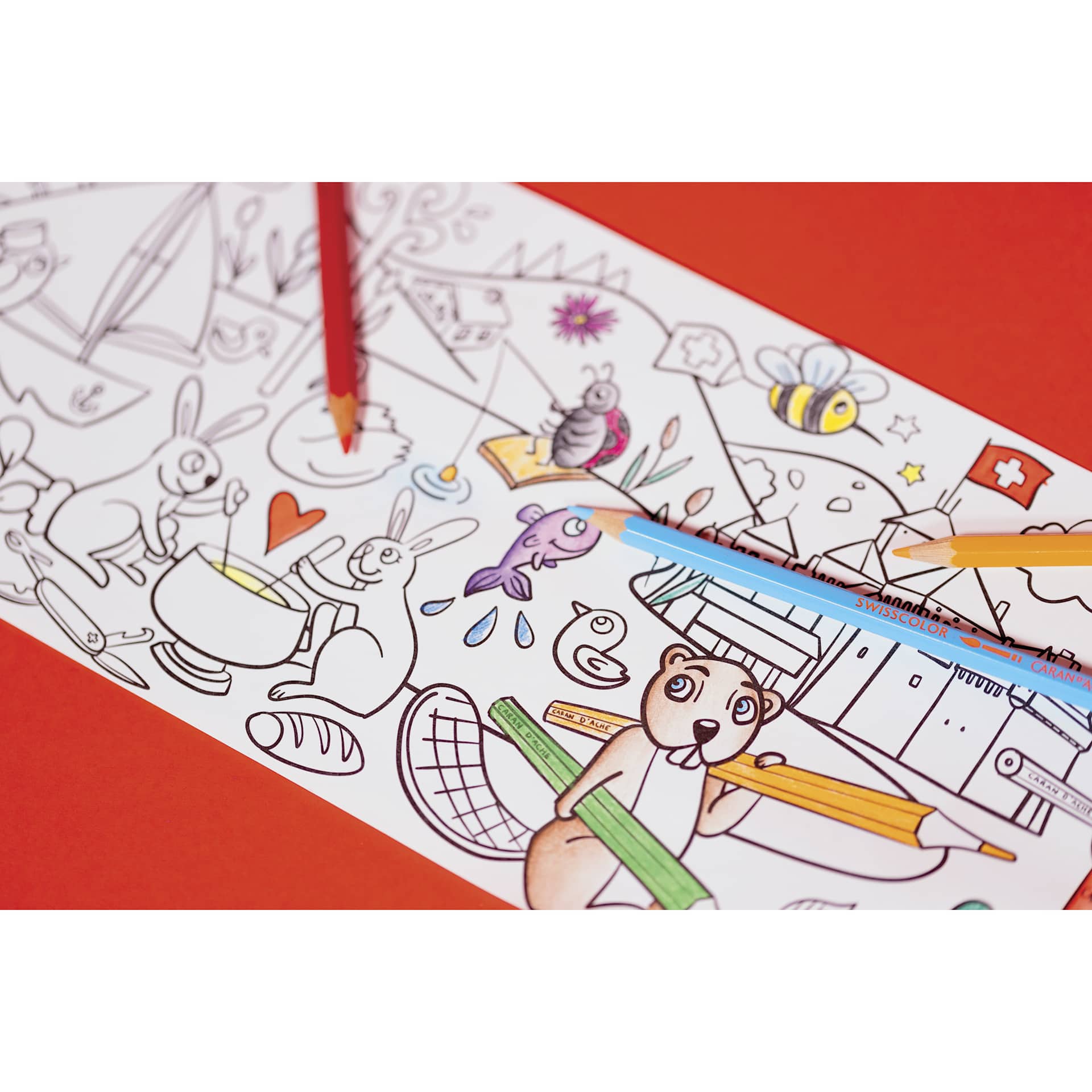 Caran d'Ache Swisscolor Aquarelle Colored Pencils and Poster, closed-up of pencils on top of poster