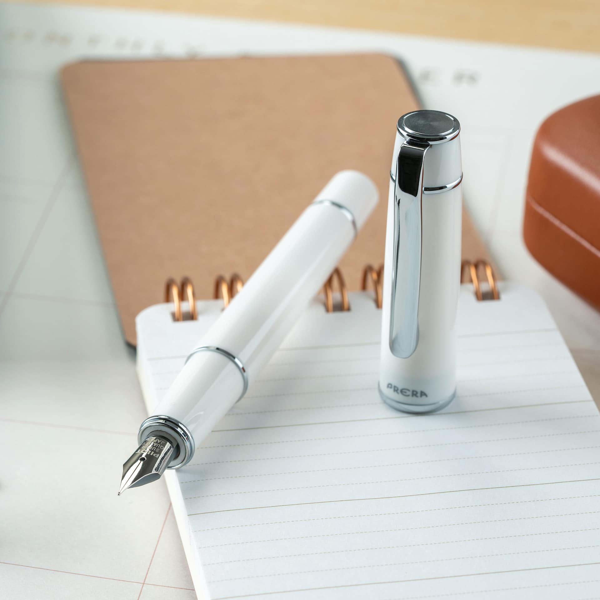 Pilot Prera Standard Fountain Pen - Porcelain White, Fine, on notepad (not included)
