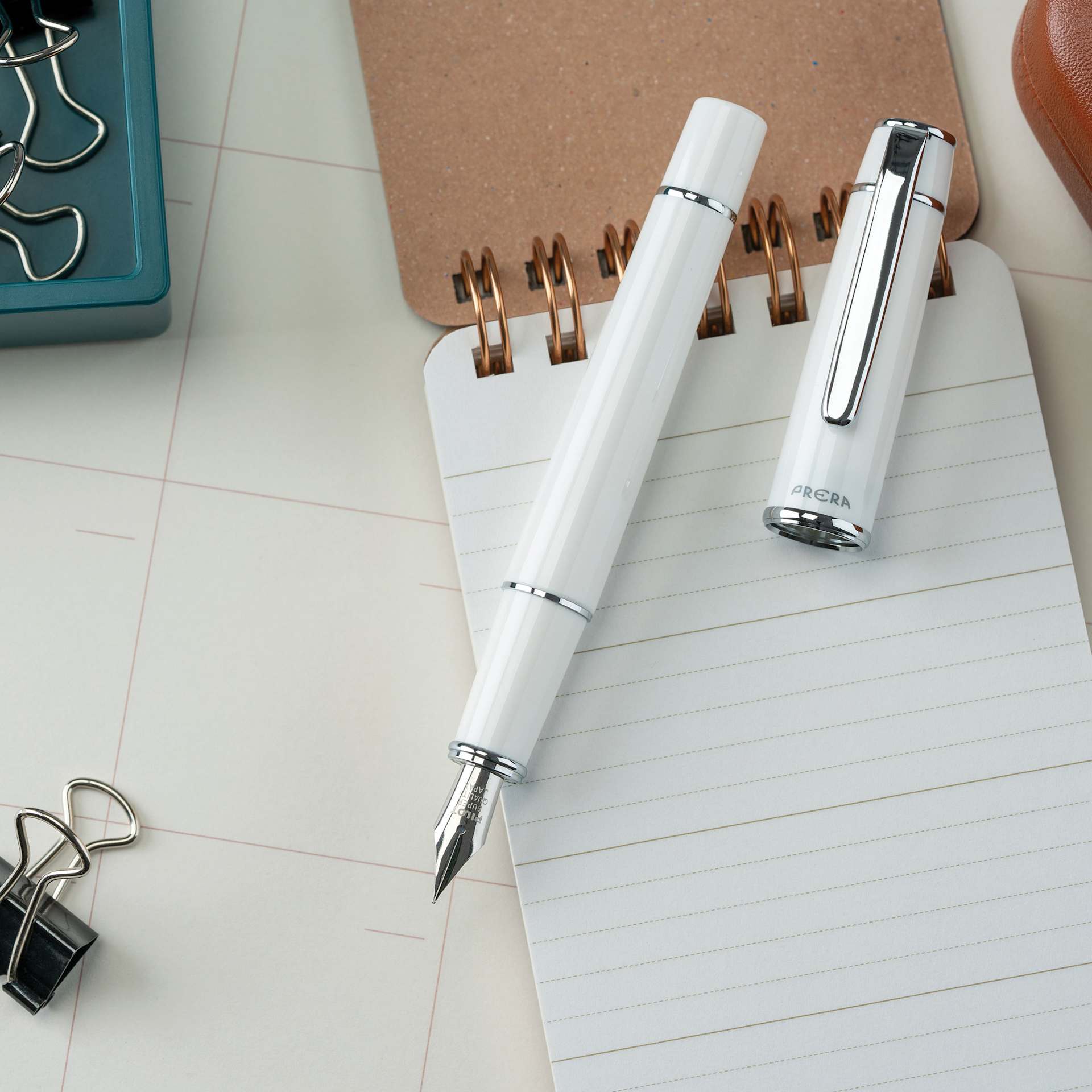 Pilot Prera Standard Fountain Pen - Porcelain White, Medium, cap off with notepad (not included)