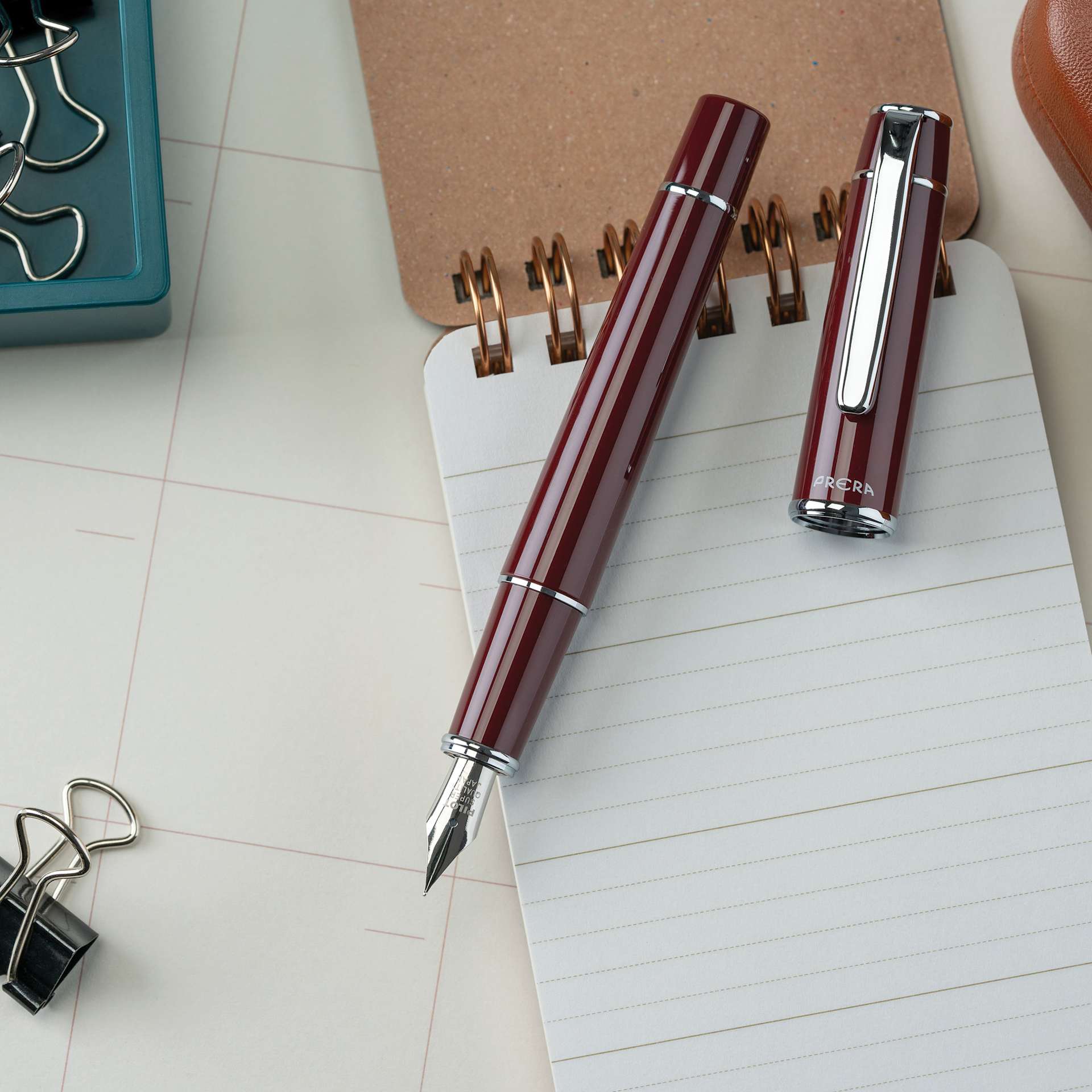 Pilot Prera Standard Fountain Pen - Cinnamon Brown, Medium, cap off with notepad (not included)
