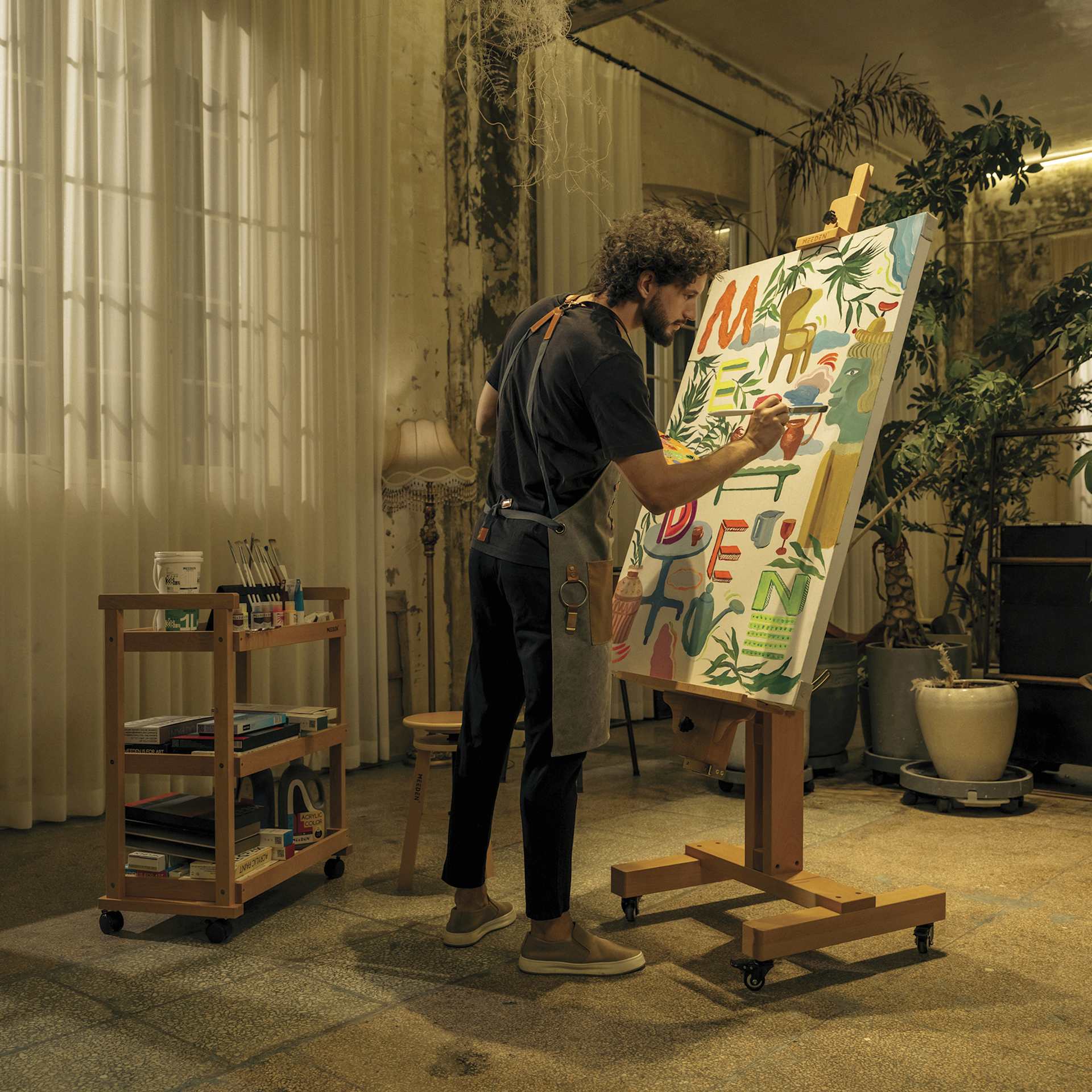 Meeden XL Adjustable Easel Stand - in use in studio, holding vertical canvas