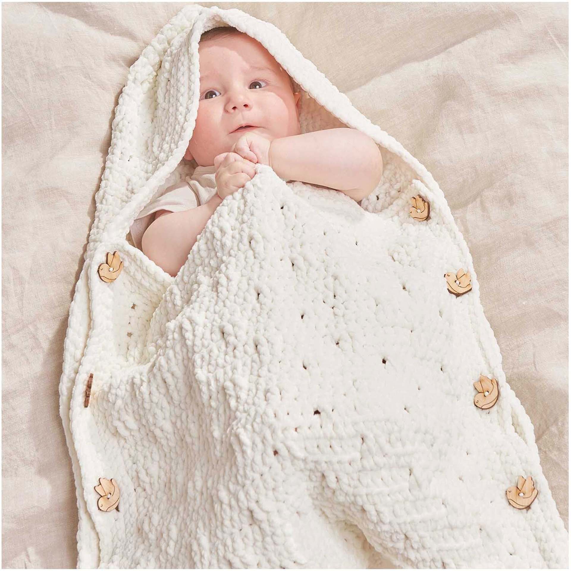 Rico Design Creative Chenillove Yarn - Cream, 120 yds showing completed baby sleep sack project