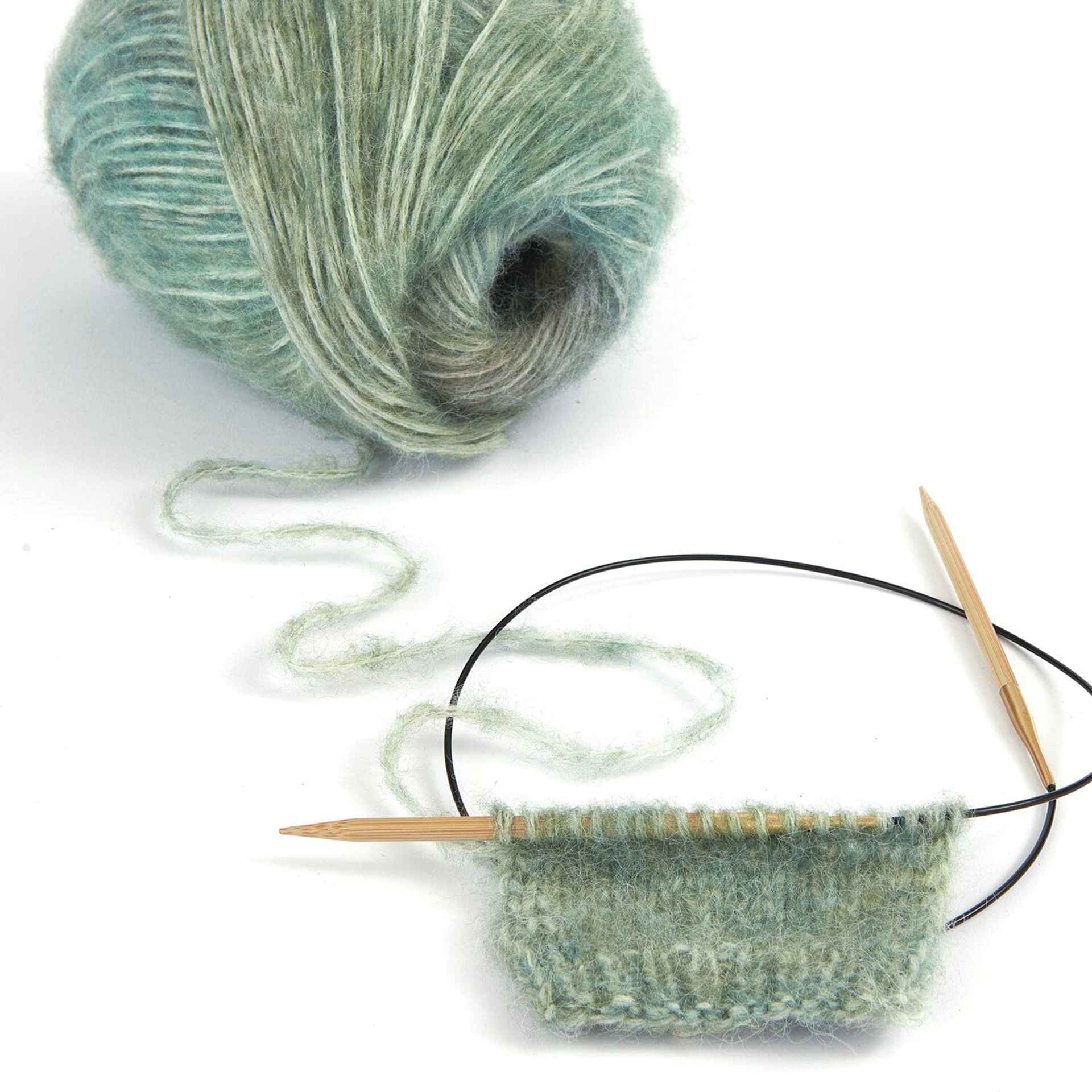 Rico Design Creative Painted Power Yarn - Forest Greens, 340 yds in the process of being knitted