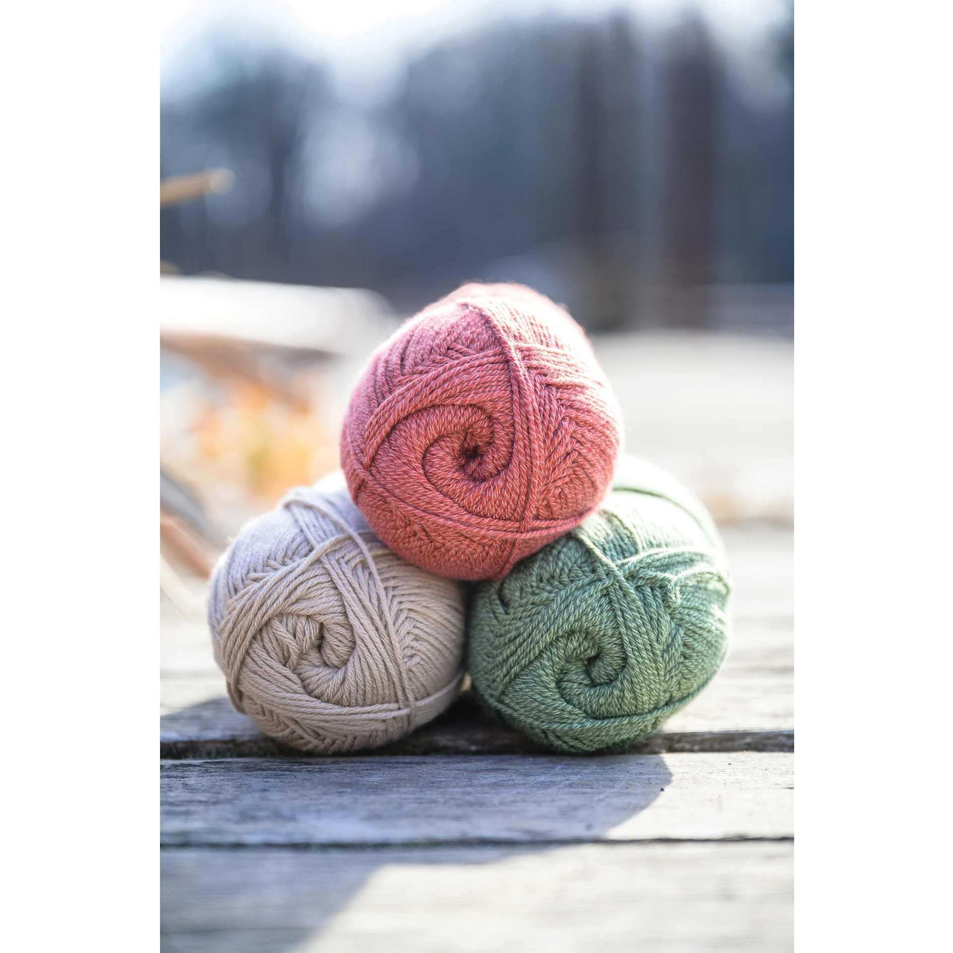 Lion Brand Cottino Yarn three available colors stacked together