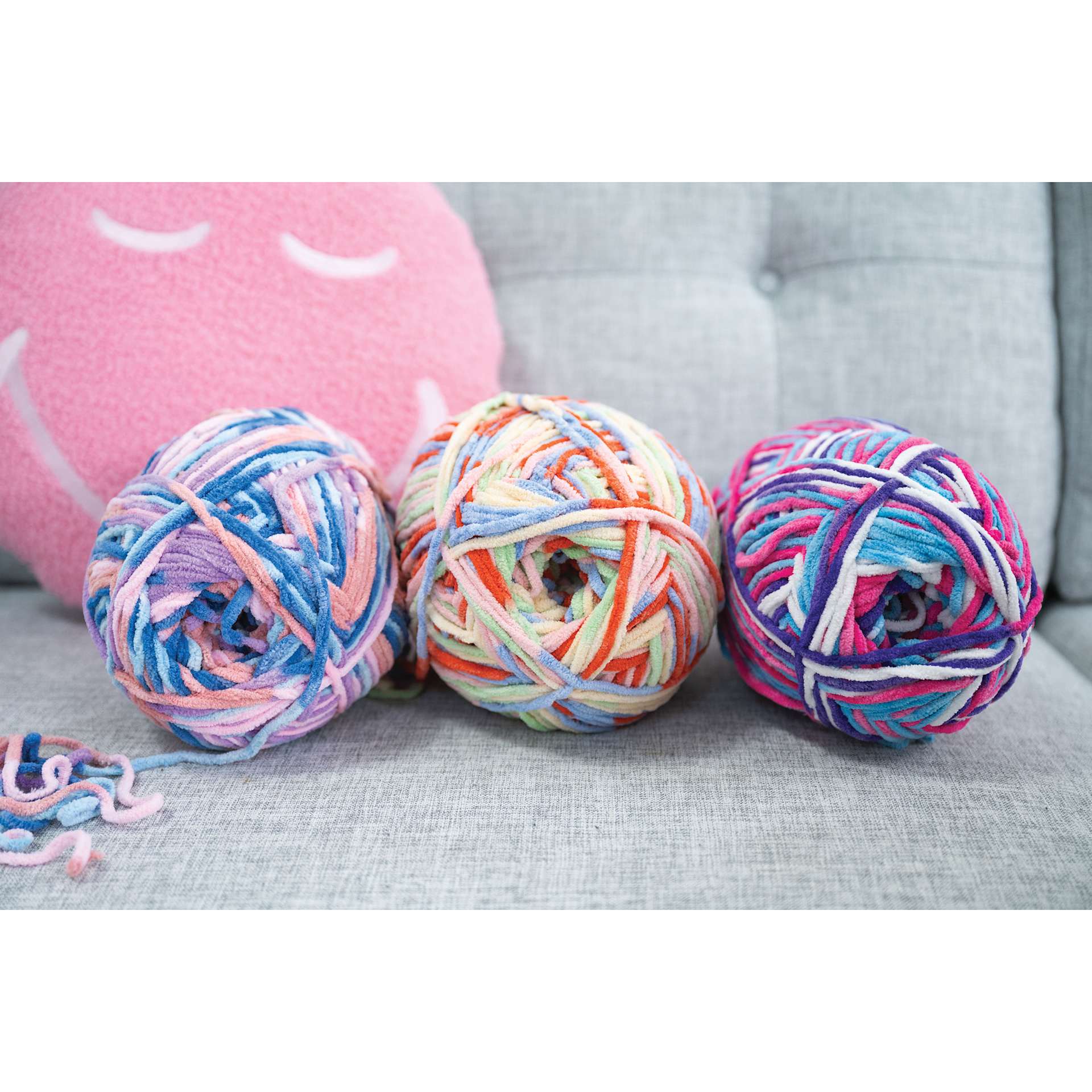 Lion Brand Cover Story Favorite Blanket Yarn shoiwng three skeins together