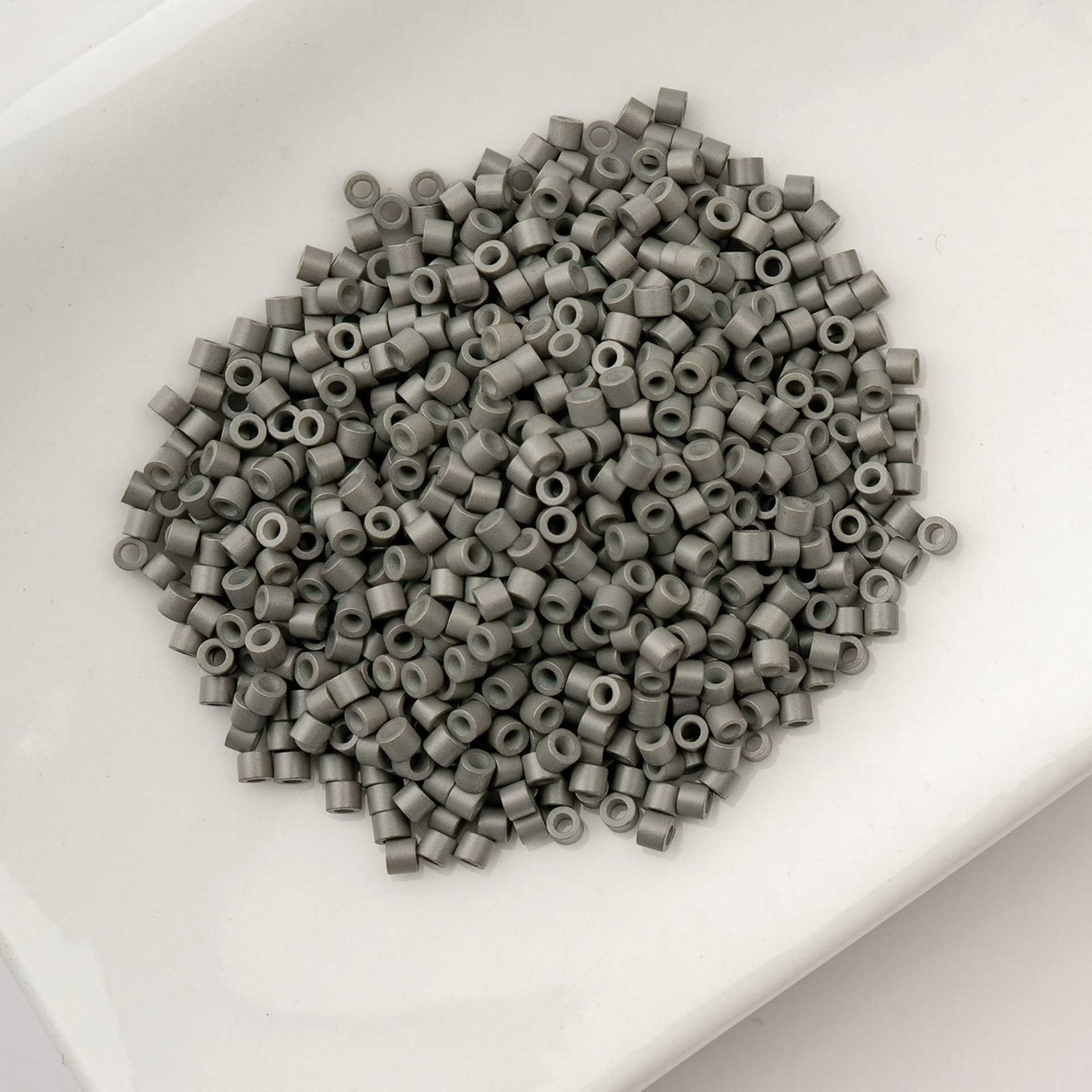 John Bead Cylin 11/0 Cylindrical Seed Beads - Grey Opaque sitting in dish