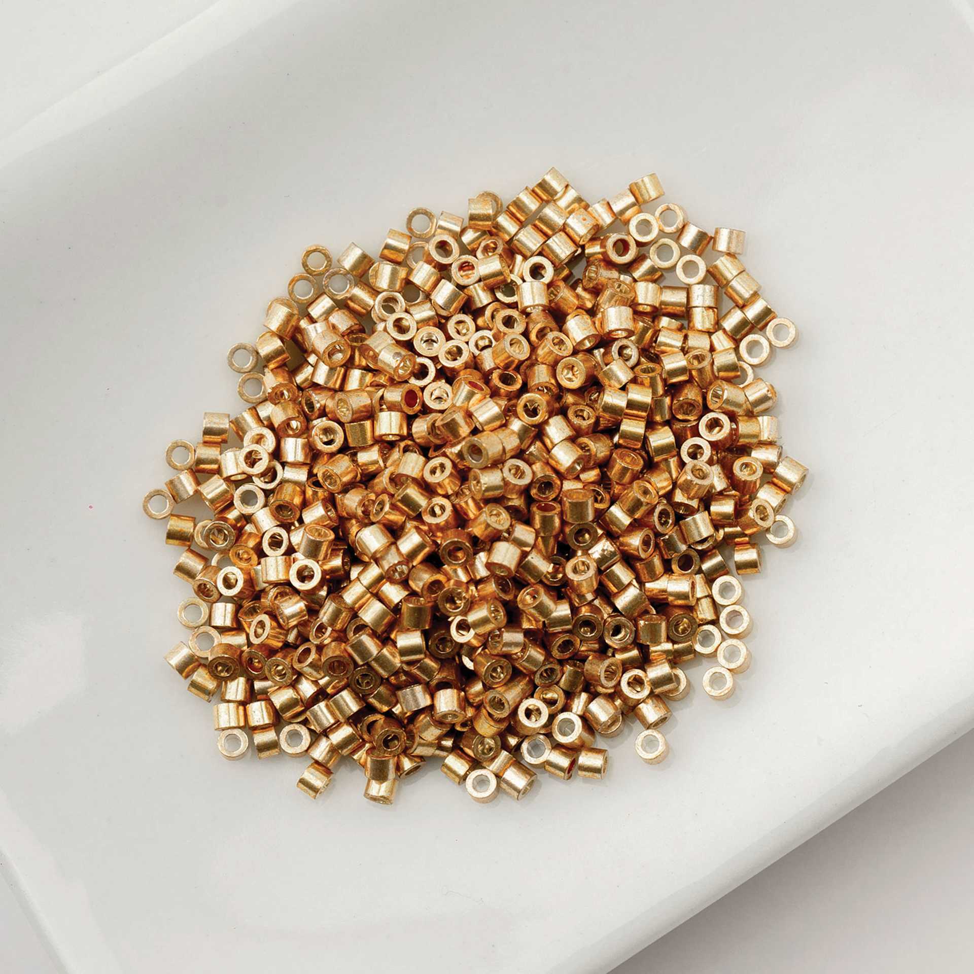 John Bead Cylin 11/0 Cylindrical Seed Beads - Toasted Caramel Opaque sitting in dish