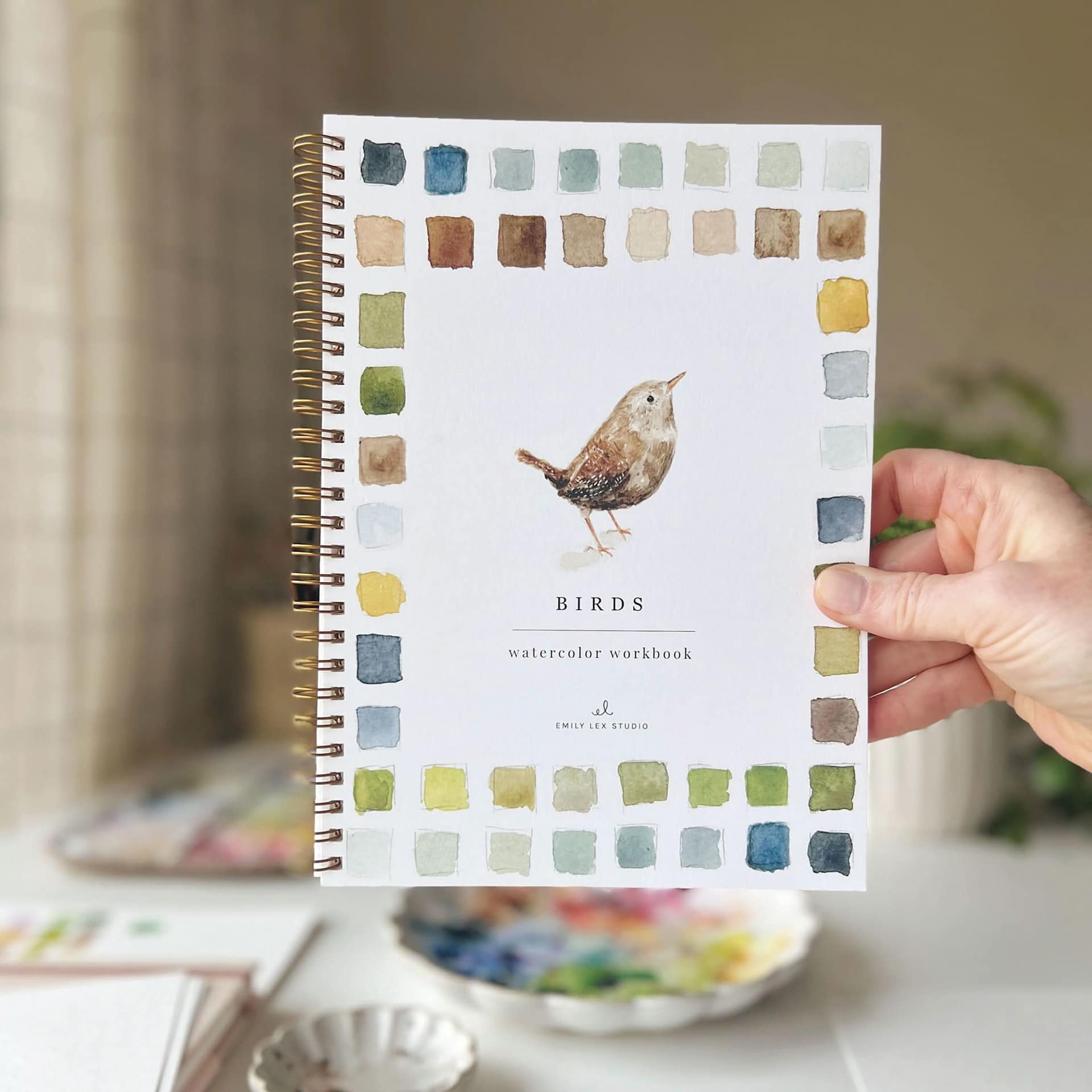 Emily Lex Studio Birds Watercolor Workbook, person holding workbook