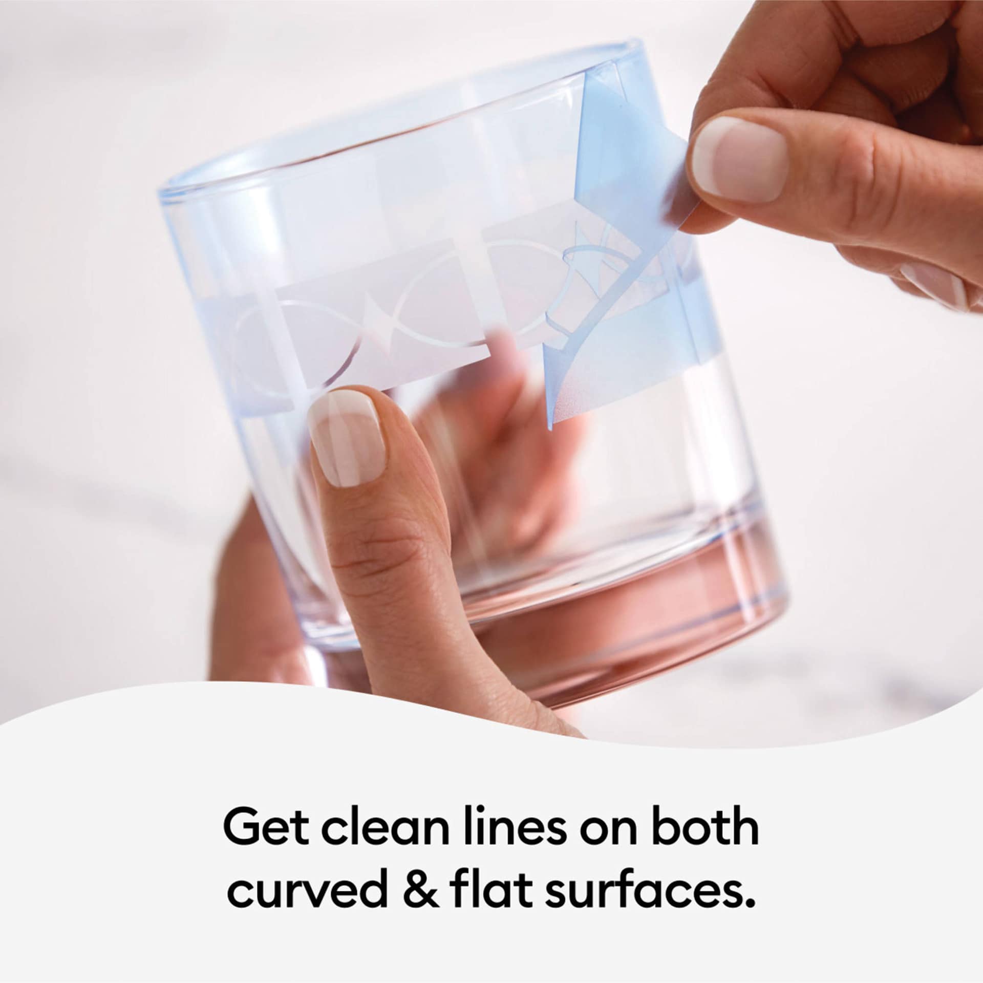 Cricut Joy Smart Stencil being removed from a glass.