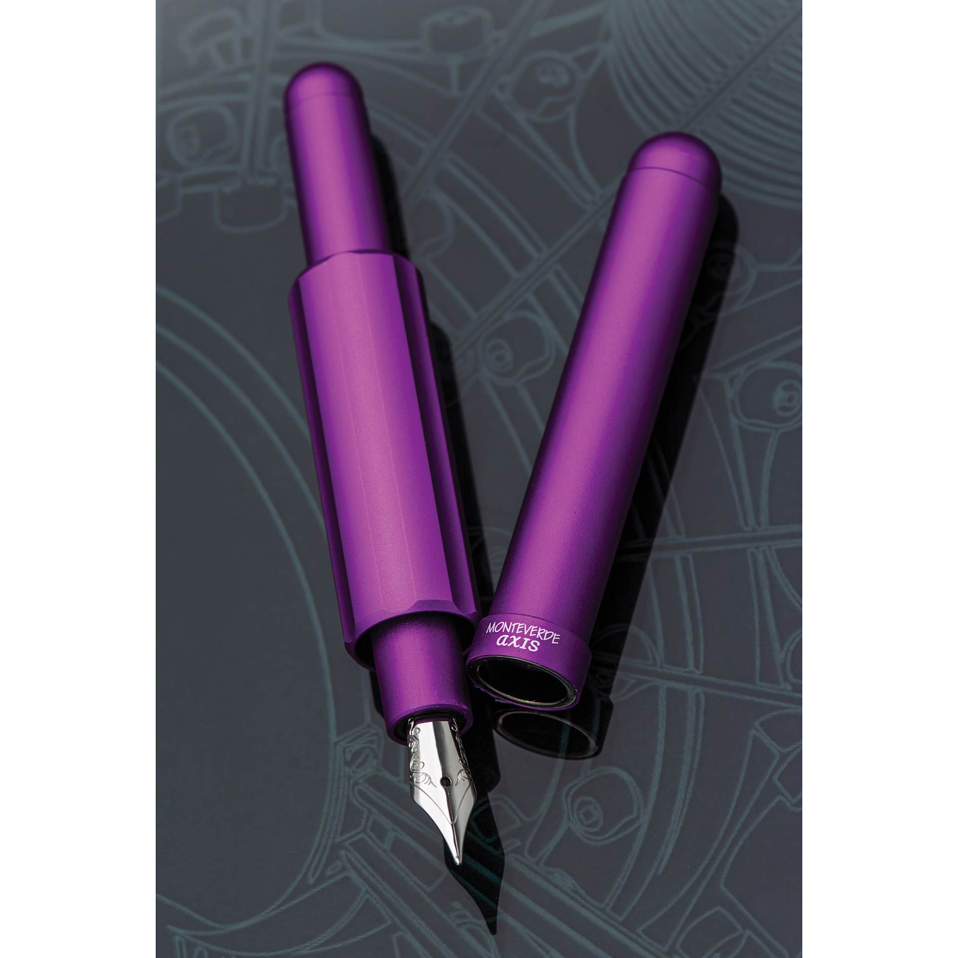 Monteverde Axis Fountain Pen - Matte Purple, Extra Fine, pen and cap on slate background (image may show a different size nib)