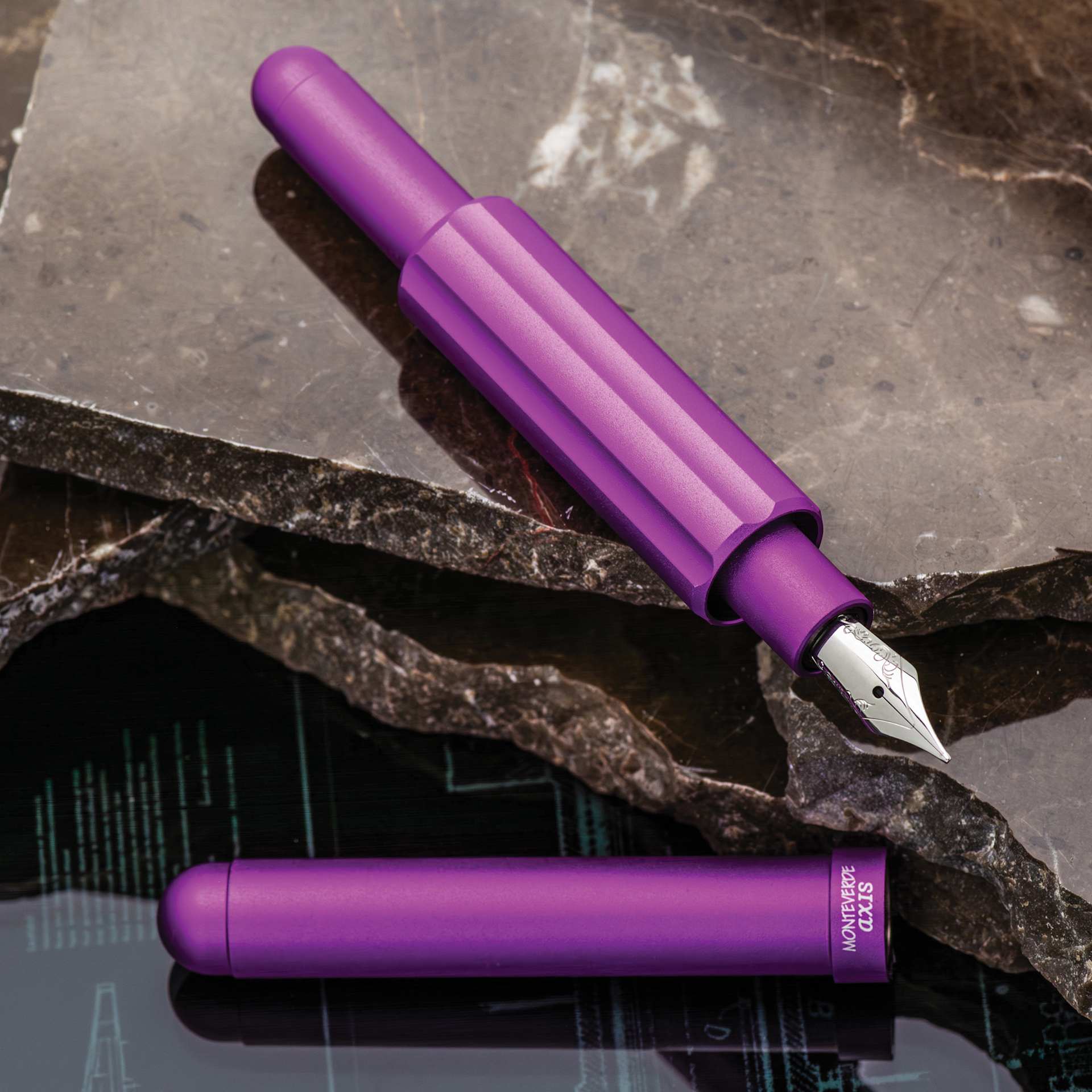 Monteverde Axis Fountain Pen - Matte Purple, Fine, pen and cap on slate background.
