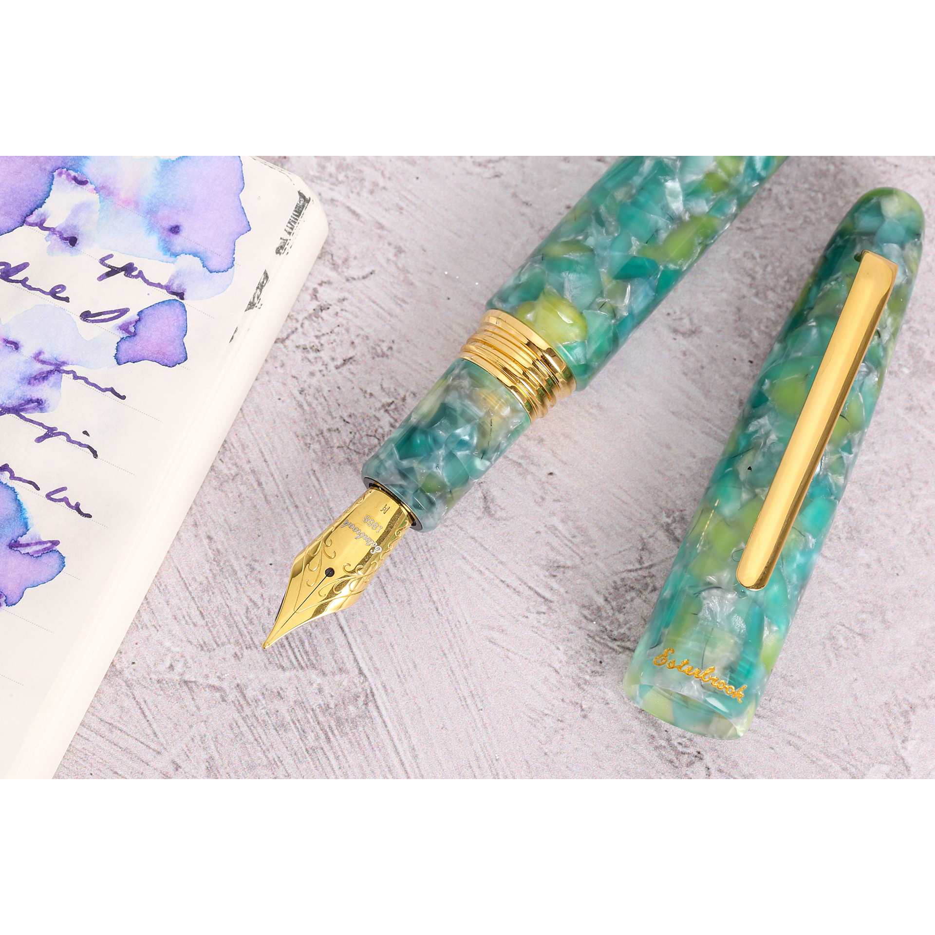 Esterbrook Estie Fountain Pen - Sea Glass, Medium Nib, uncapped with notebook