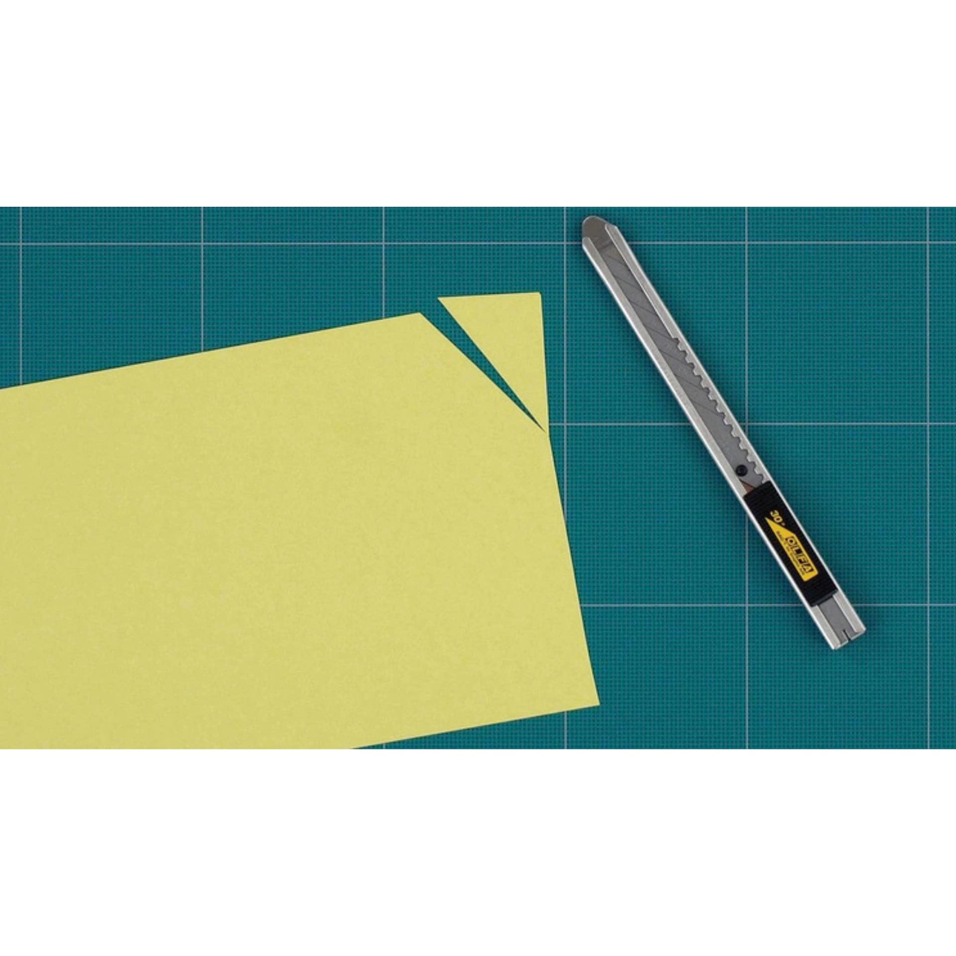 Olfa Stainless-Steel Snap-Off Graphics Knife, next to sliced paper