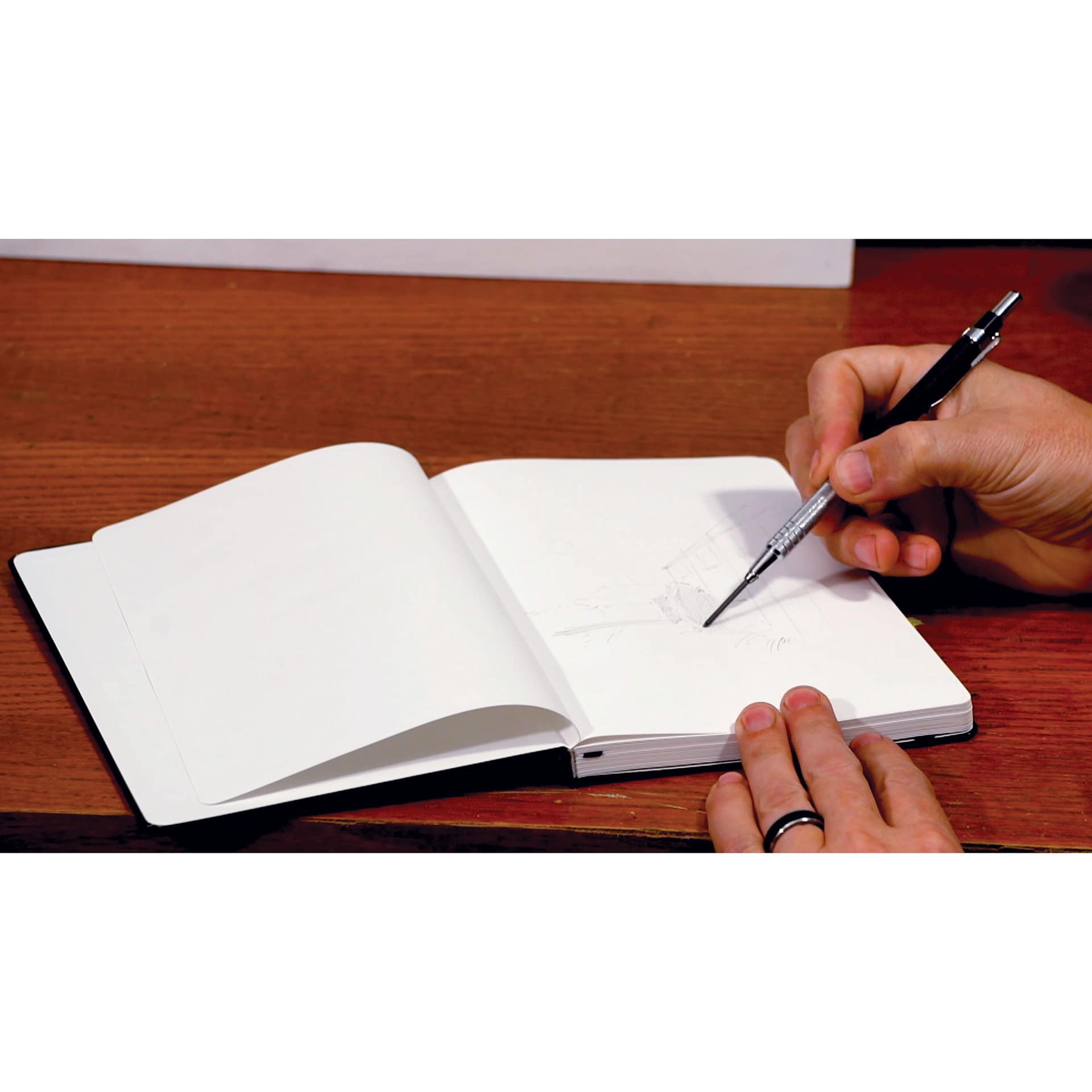 Karst Stone Paper Notebook, open on desk
