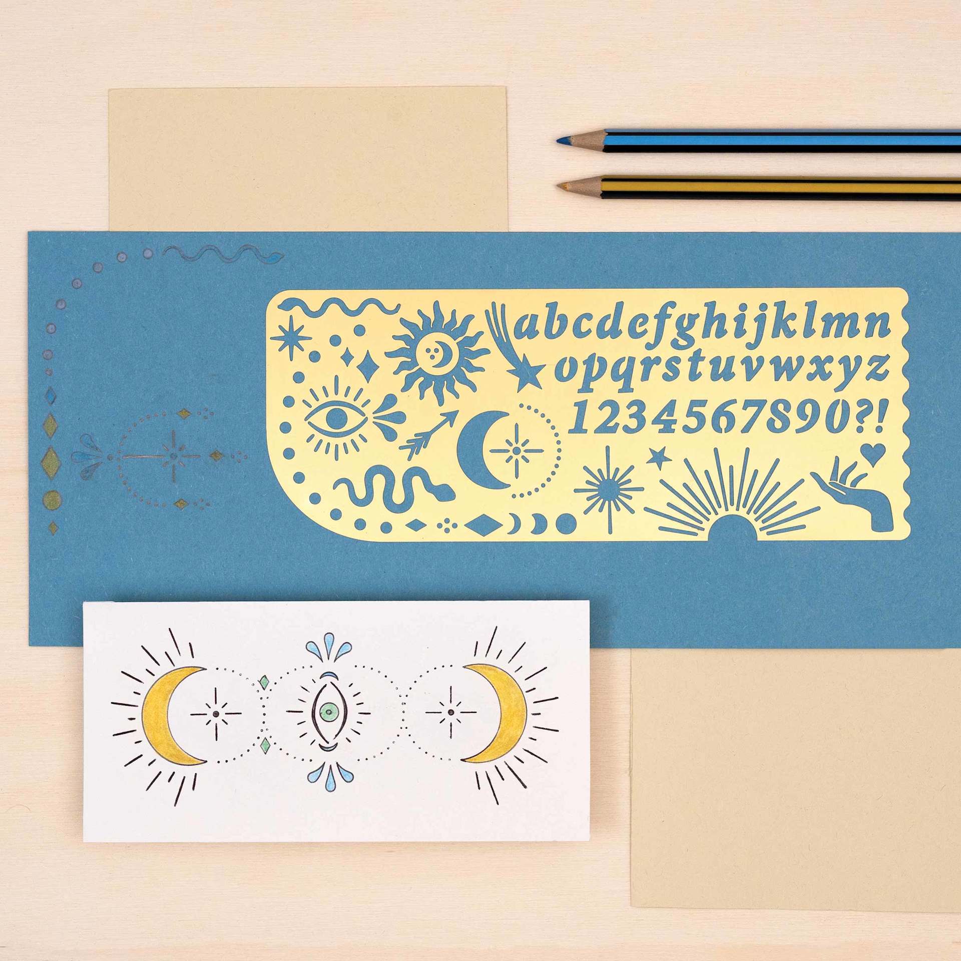 Another Studio Brass Stencil - Celestial, stenciled paper