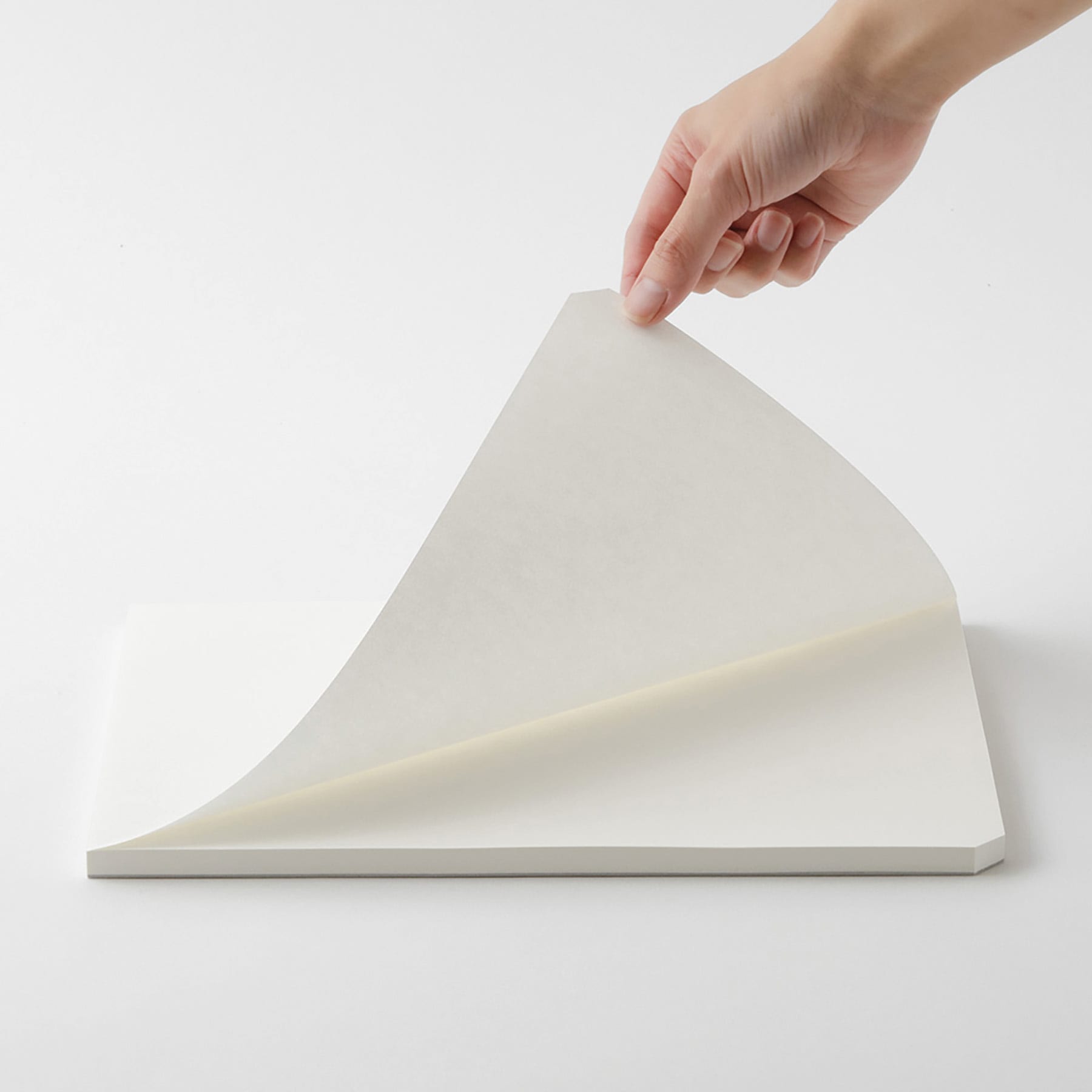 Midori MD Cotton Paper Pad - A4, Blank, White, 90 Sheets, sheet being lifted
