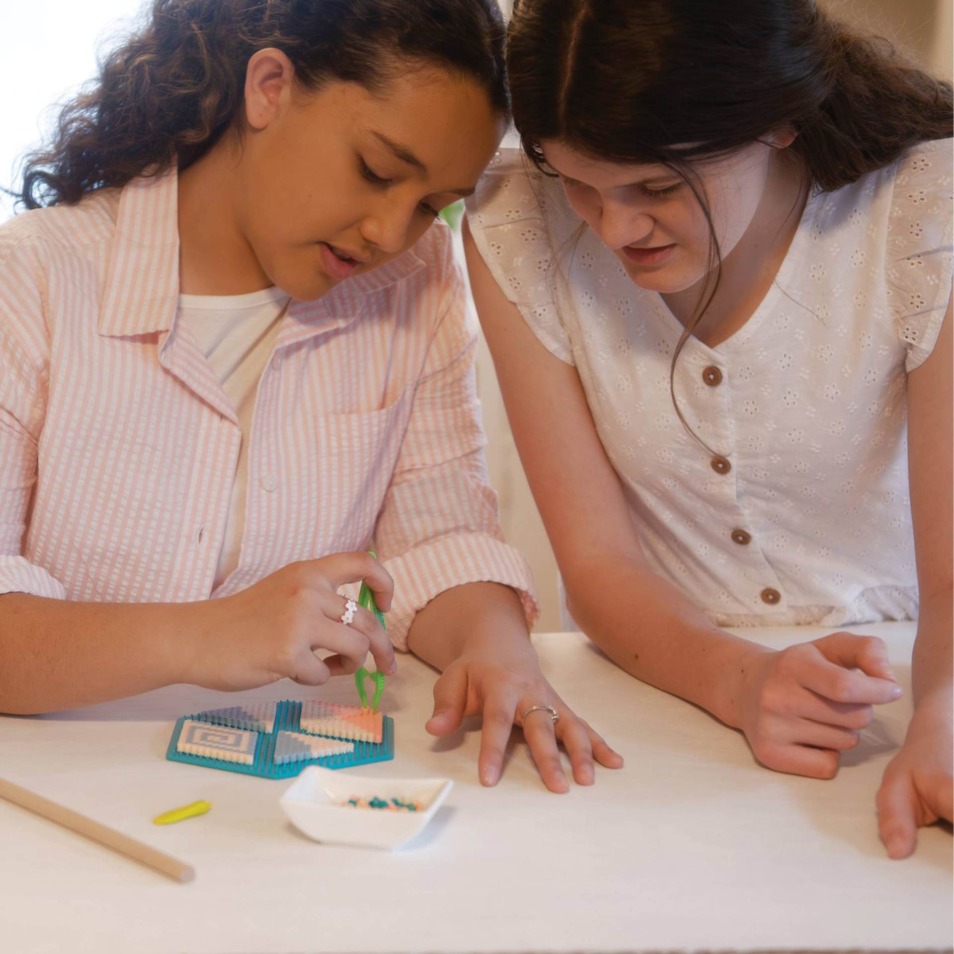 Perler Bead D.I.Y. Geometric Mobile Activity Kit two girls working on mobile at table