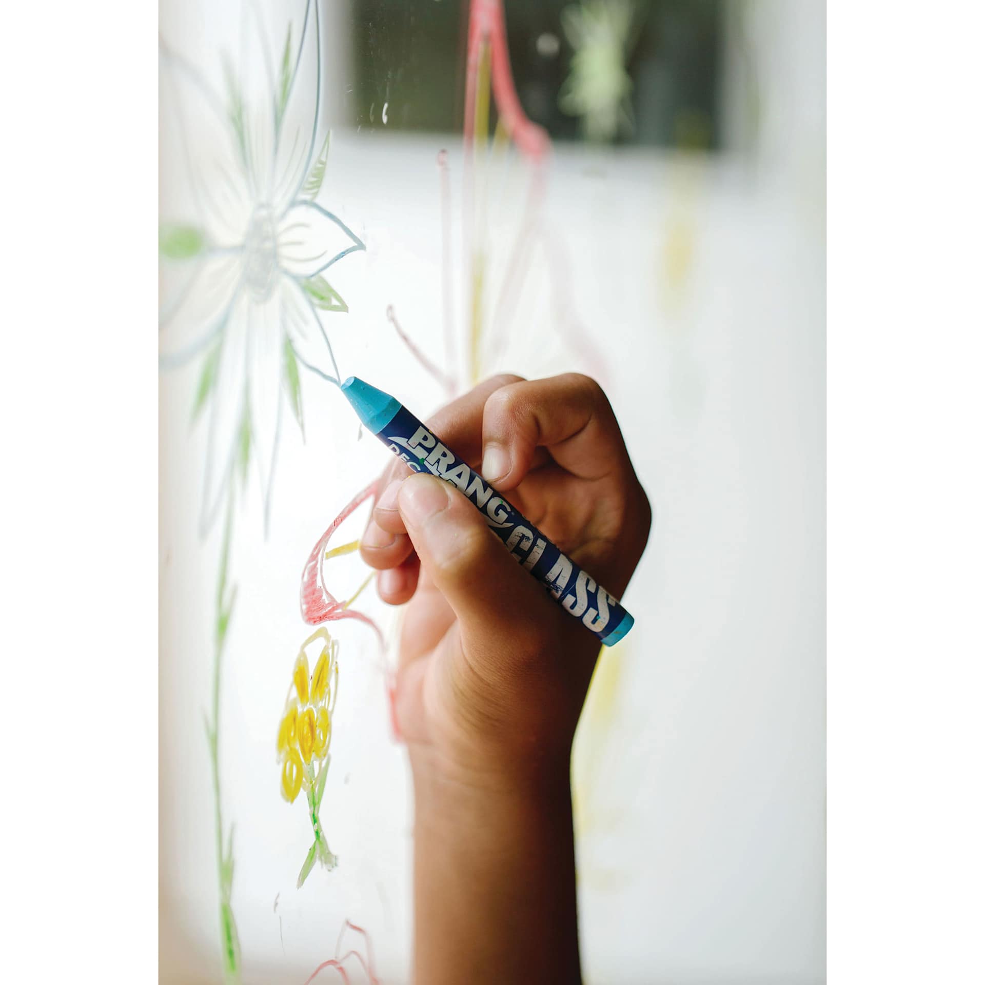 Prang Glass Decor Crayons - Set of 10, in hand using cryaon tot draw on glass window